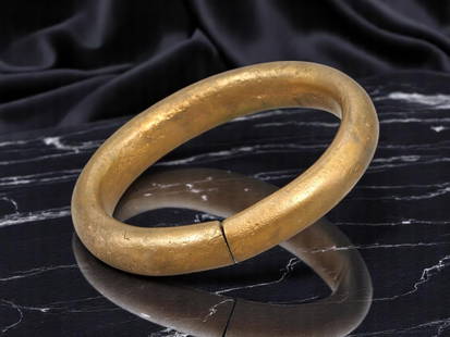AFRICAN TRIBAL Bronze Ring Currency - Solid Oval Form (5.7 cm): A weighty cast bronze ring currency form measuring 5.7 cm in diameter, this oval bracelet-like piece exemplifies traditional West African trade practices where adornment and value coexisted. With a cl