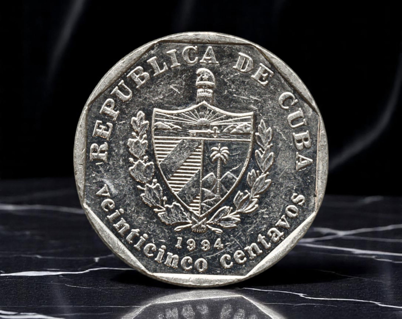 CUBA: Colonial Heritage - Trinidad 25 Centavos Coin, 1994, 23mm: Struck in 1994, this 25 centavos coin celebrates Cuba's architectural and cultural patrimony through a finely engraved depiction of the colonial city of Trinidad. Once a hub of sugar wealth and Spanis