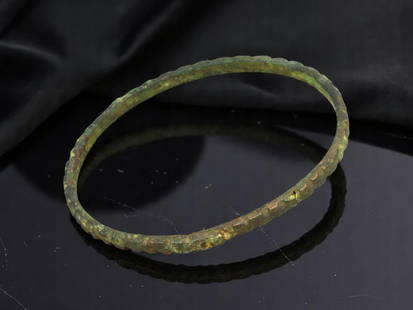 VIKING Bronze Bracelet - Hammered Ridge Band with Continuous Circular Form (6.5 cm): This Viking-period bracelet features a closed-loop design with a subtly hammered, ridge-textured band. The sharply faceted surface creates a rhythmic pattern of dimples and flats, likely achieved by p