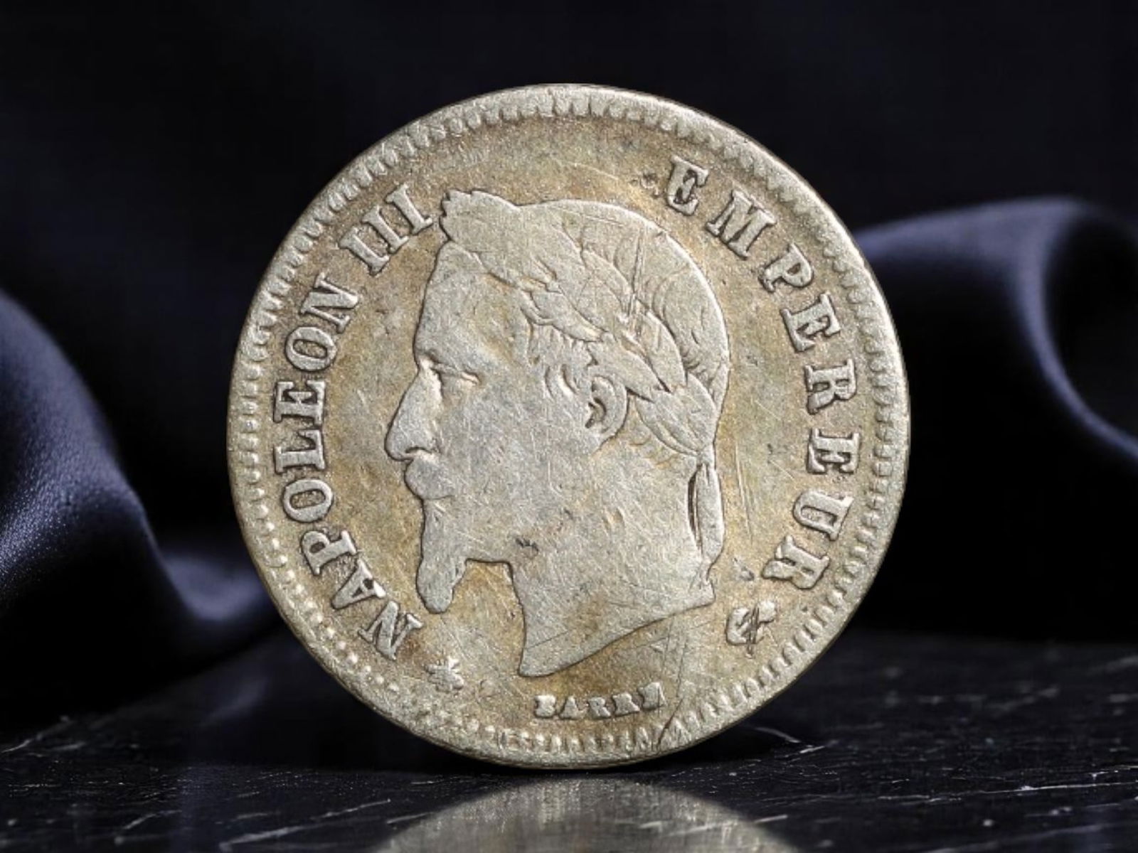 FRANCE: Napoleon III - Imperial Crown Silver 20 Centimes Coin, 1866 A Paris Mint, 15mm: Issued during the zenith of France's Second Empire, this diminutive silver 20 centimes piece from 1866 encapsulates the enduring authority of Napoleon III in both numismatic and national symbolism. Th