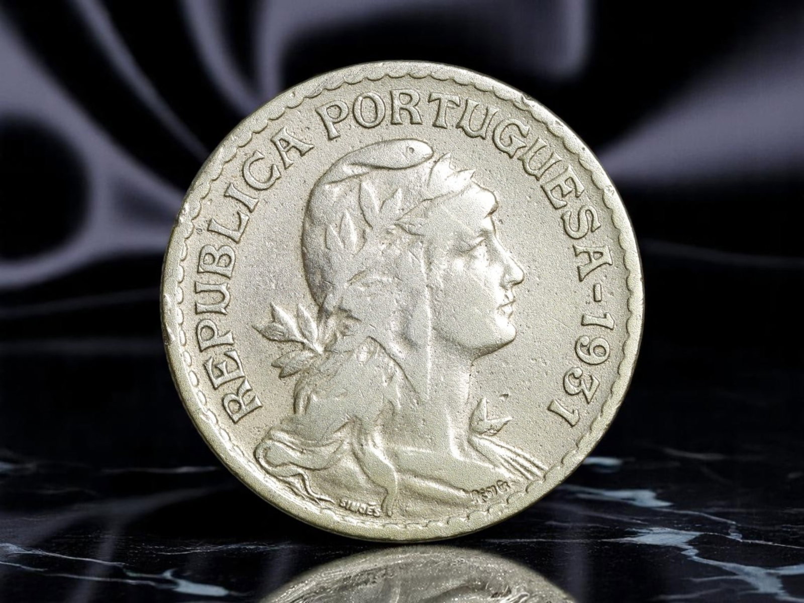 PORTUGAL: Republic Reborn - Liberty Allegory 1 Escudo Coin, 1937, 26mm: Issued at the height of Portugal's Estado Novo regime, this 1937 1 Escudo coin blends neoclassical iconography with nationalist symbolism. The allegorical figure of Liberty-laureled and robed-gazes re