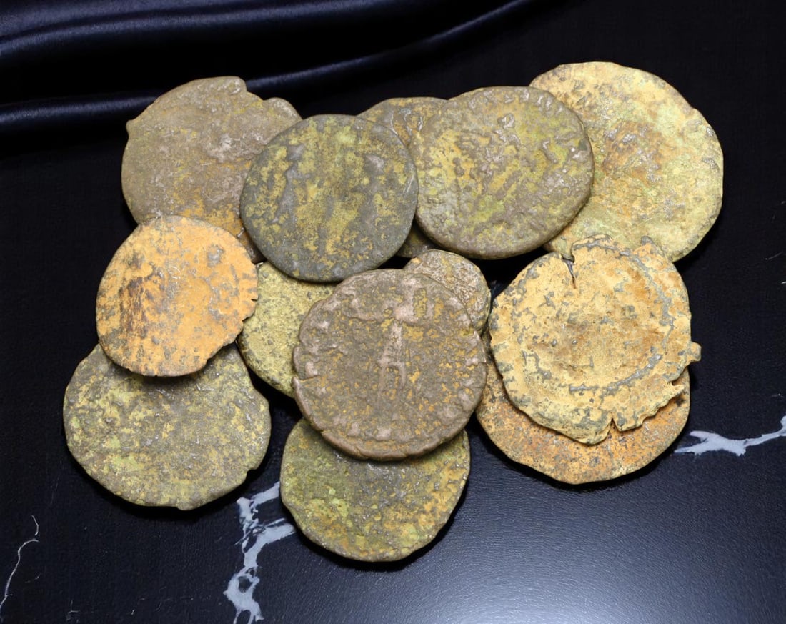 ROMAN EMPIRE: Lot of 13 Bronze Coins - Provincial & Imperial Era, 8-20mm: A compact yet historically resonant assemblage of ancient Roman bronze coins, these pieces hail from the vast provincial and imperial mints that underpinned Rome's economic fabric from the 1st through