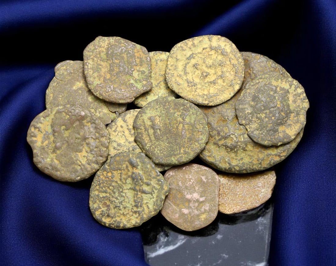 ROMAN EMPIRE: Lot of 11 Bronze Coins - Imperial Busts & Provincial Echoes, 12-24mm: An evocative assemblage of 11 bronze coins from the Roman Empire, spanning a range of imperial periods and regional mints. Though time has softened many of their details, remnants of laureate busts, d