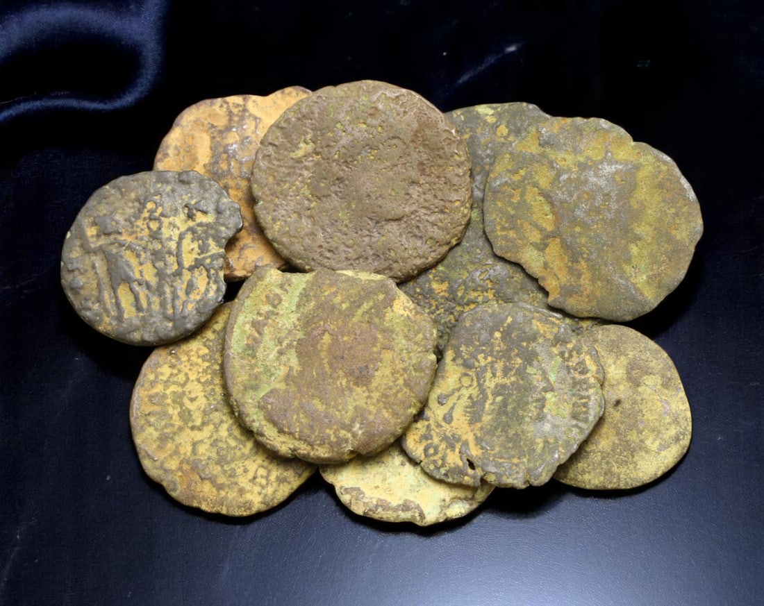 ROMAN EMPIRE: Lot of 10 Bronze Coins - Provincial & Imperial Era, 12-21mm: A compact yet historically resonant assemblage of ancient Roman bronze coins, these pieces hail from the vast provincial and imperial mints that underpinned Rome's economic fabric from the 1st through