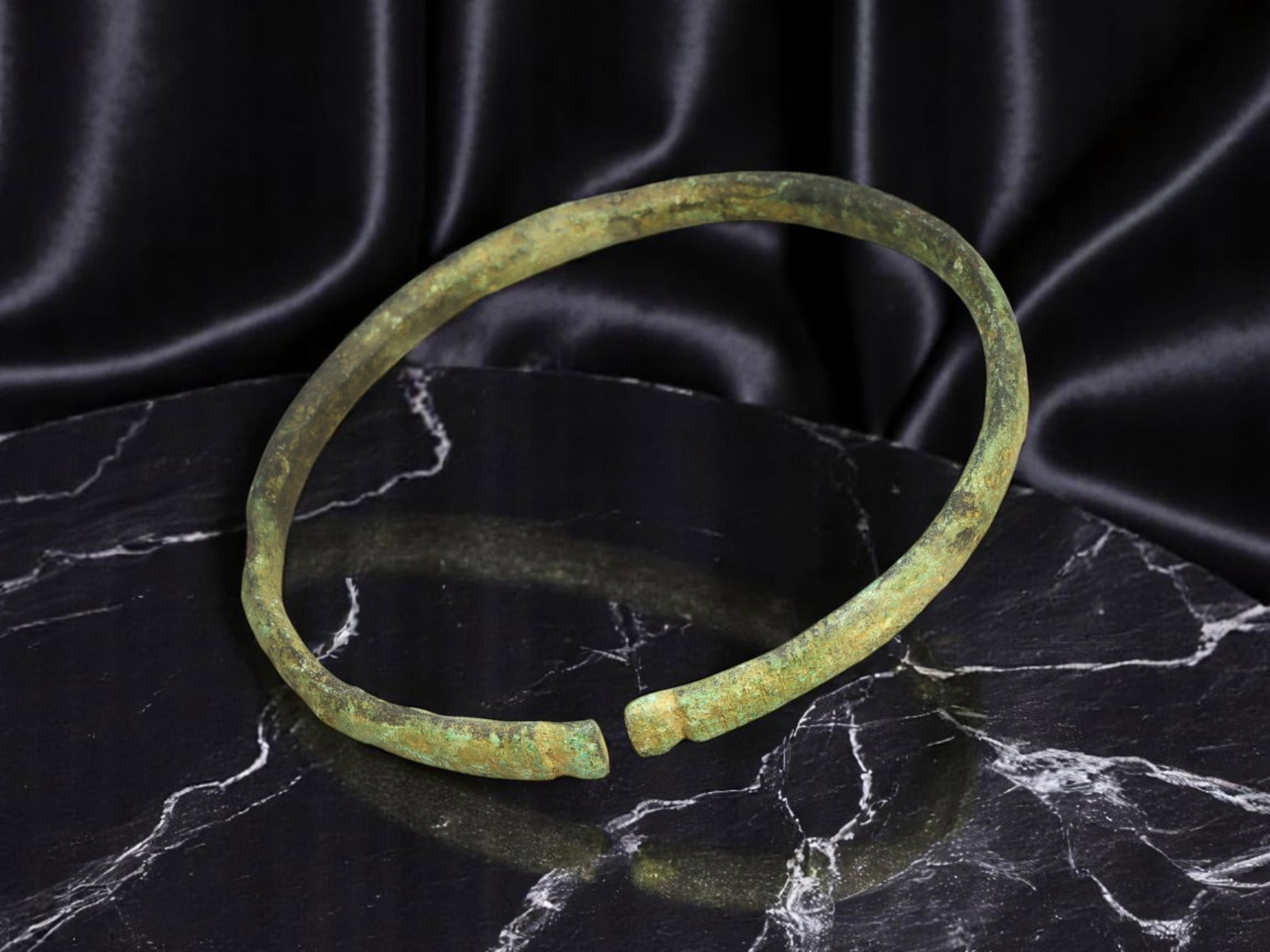 VIKING Bronze Bracelet - Flattened Rod with Pinched Ends, Open-Ended Form (6.2 cm): Cast with utilitarian solidity, this Viking-era bracelet presents a subtly faceted rod with uneven hammer-textured surfaces and slightly pinched terminals. The open-ended silhouette is functional and 