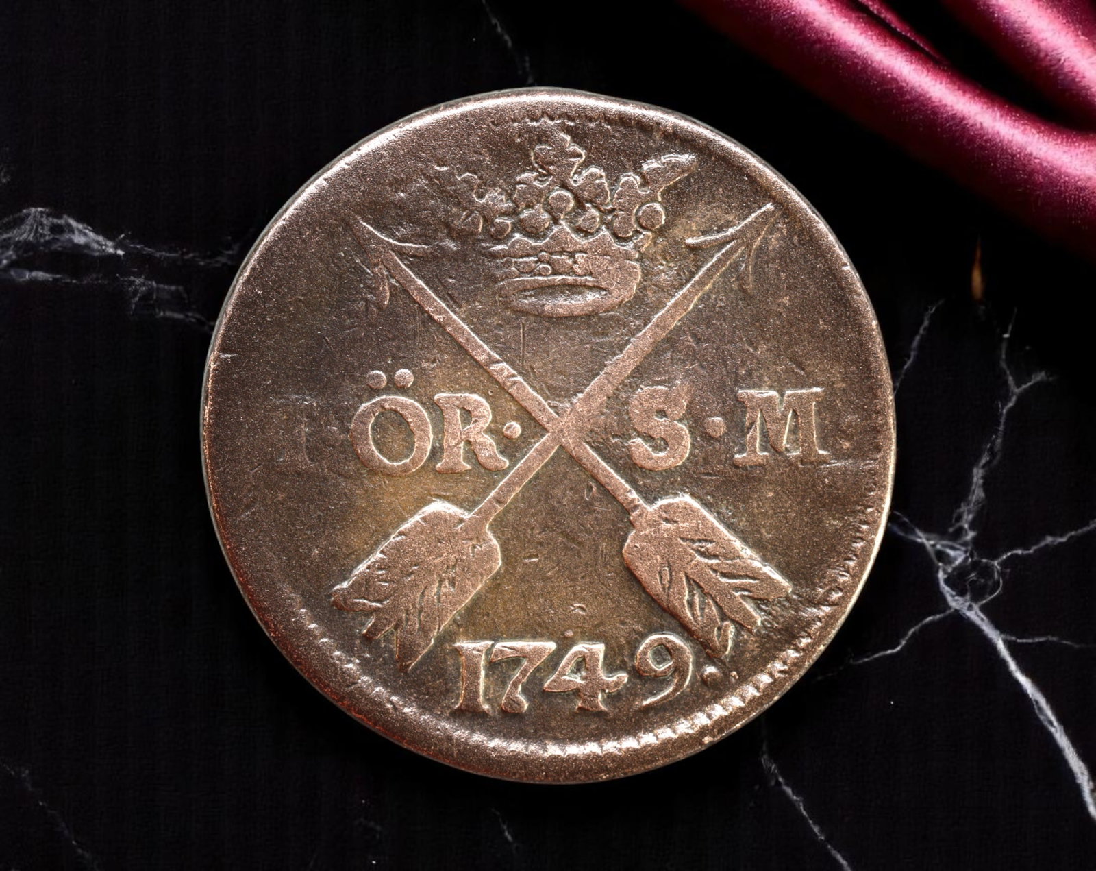 SWEDEN: Frederick I - Copper Monetary Foundation 1 Ore SM Coin, 1749, 30.5mm: Struck during Sweden's transformative "Age of Liberty," this substantial 1749 1 Ore SM copper coin reflects the kingdom's pragmatic monetary policy under the nominal rule of Frederick I. The obverse b