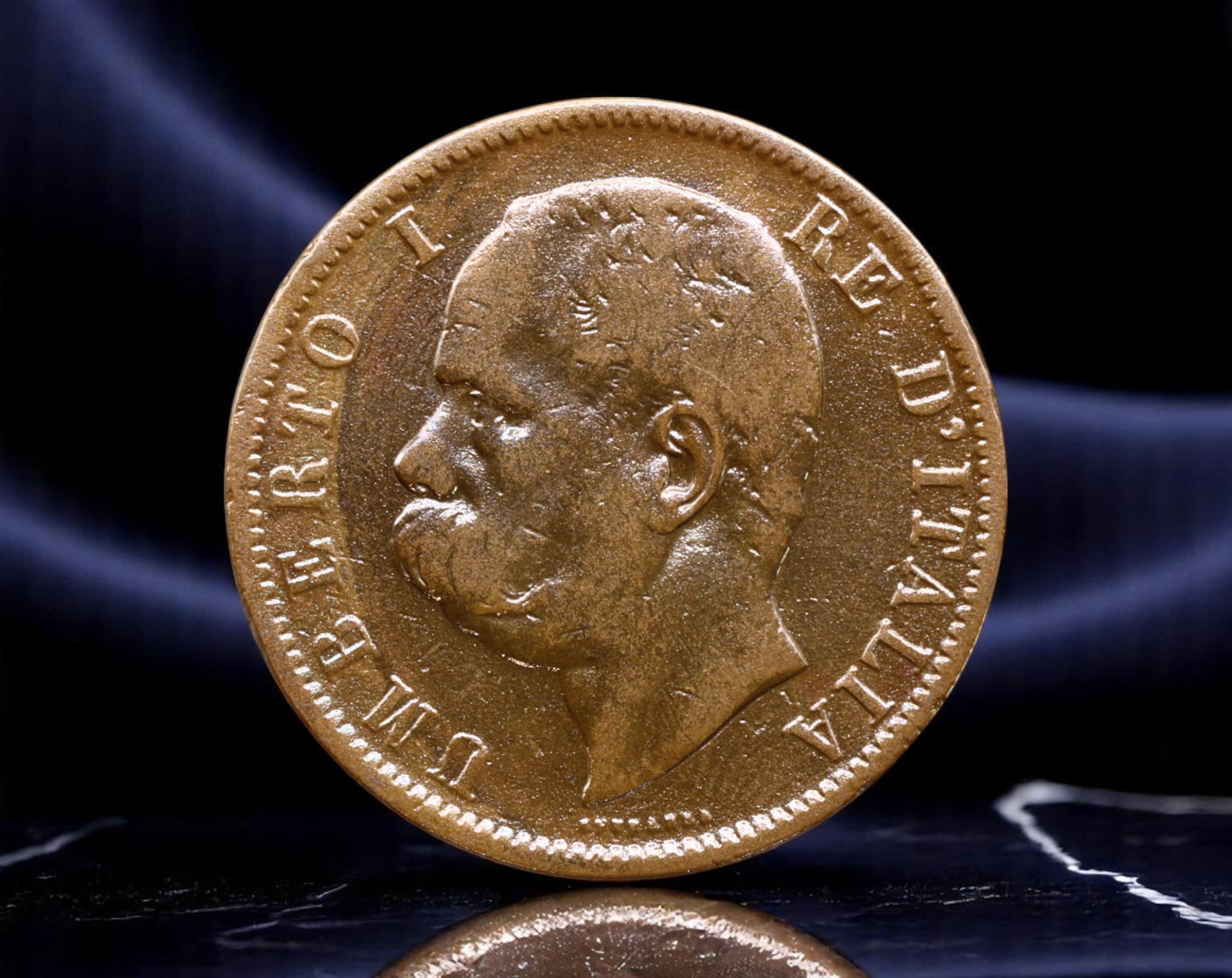 ITALY: Umberto I - Star of Savoy 10 Centesimi Coin, 1894, 30mm: This 1894 10 Centesimi coin from the reign of Umberto I captures the assertive symbolism of a maturing Italian monarchy. The king's sharply profiled bust is framed by the inscription UMBERTO I RE D'IT
