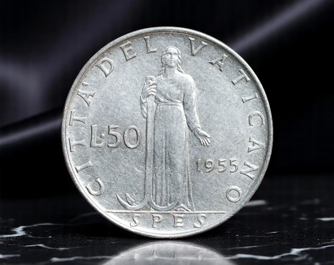 VATICAN CITY: Pius XII - Christian Hope Lira 50 Coin, 1955, 24mm: Issued during the papacy of Pius XII, this 1955 Vatican 50 Lire coin evokes the theological virtue of Spes (Hope), represented by a serene, robed female figure holding an anchor-a symbol of steadfast 