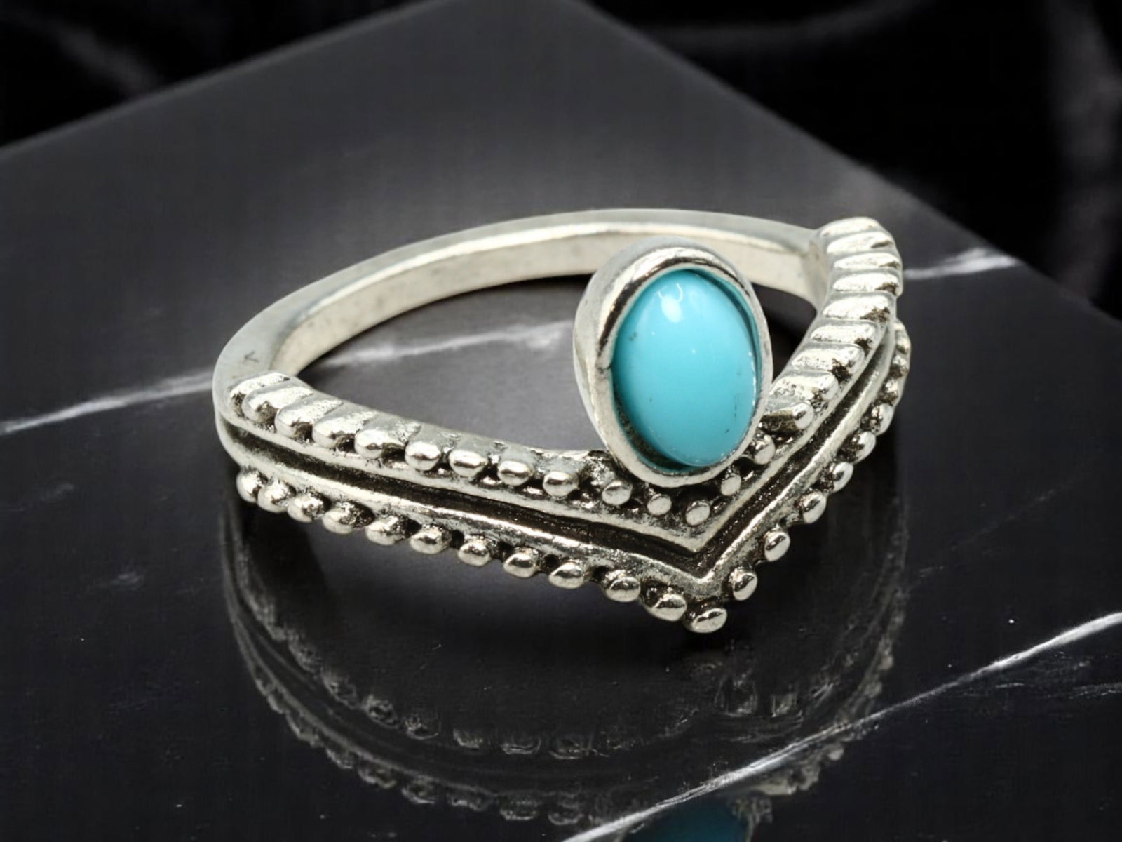 NATURE SYMBOLISM: Ring - Beaded Chevron with Oval Turquoise-Like Cabochon, Silvertone, Size 5.5: Echoing natural and tribal motifs, this silvertone ring features a beaded chevron design framing a vivid turquoise-like oval cabochon. The raised granulation texture adds dimension and grounding contr