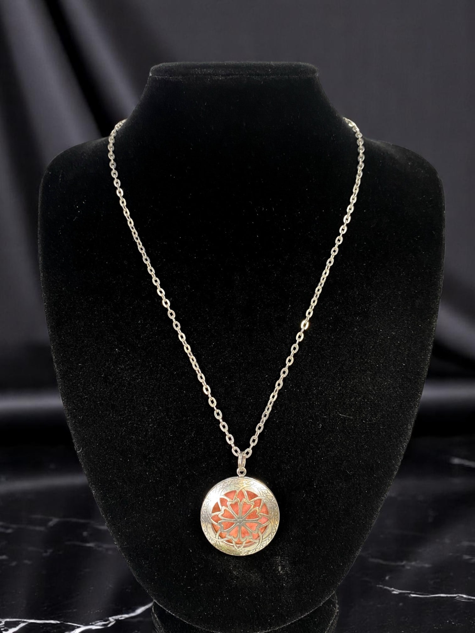 VINTAGE ESTATE: Locket Necklace - Floral Motif Medallion, Silvertone Chain, Opens for Keepsake 66cm: From an estate jewelry collection, this vintage locket necklace blends delicate artistry with sentimental charm. The round silvertone medallion features a vibrant floral motif in soft coral and sage-l
