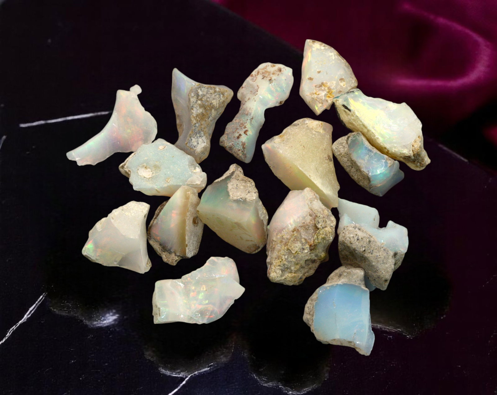 GEM LOT: Ethiopian Welo Opal Rough - Iridescent Play-of-Color in Matrix, Mixed Forms (6g): An estate-sourced parcel of natural Ethiopian Welo Opal rough, this lot features raw, matrix-hosted specimens with vibrant play-of-color across milky, translucent, and honey-toned bodies. Flashes of g