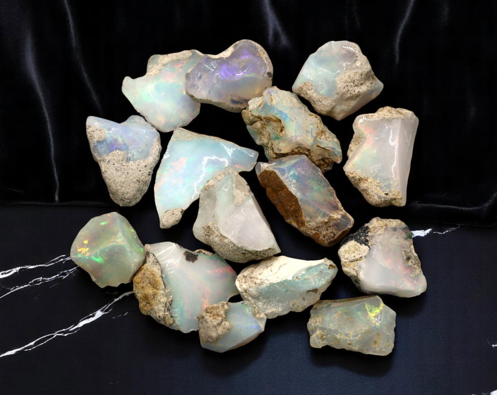 GEM LOT: Ethiopian Welo Opal Rough - Iridescent Play-of-Color in Matrix, Mixed Forms (7g): An estate-sourced parcel of natural Ethiopian Welo Opal rough, this lot features raw, matrix-hosted specimens with vibrant play-of-color across milky, translucent, and honey-toned bodies. Flashes of g