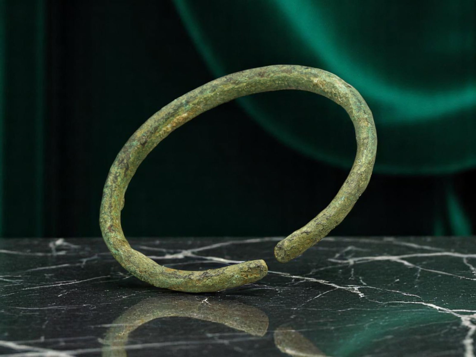 CELTIC PROTO-CURRENCY Ring - Hand-Formed Trade Band with Earthen Patina (5.1 cm): This 5.1 cm proto-currency ring exemplifies the utilitarian elegance of early Celtic trade objects. Fashioned with subtly uneven shaping and a rich earthen green patina, it features gently flattened e