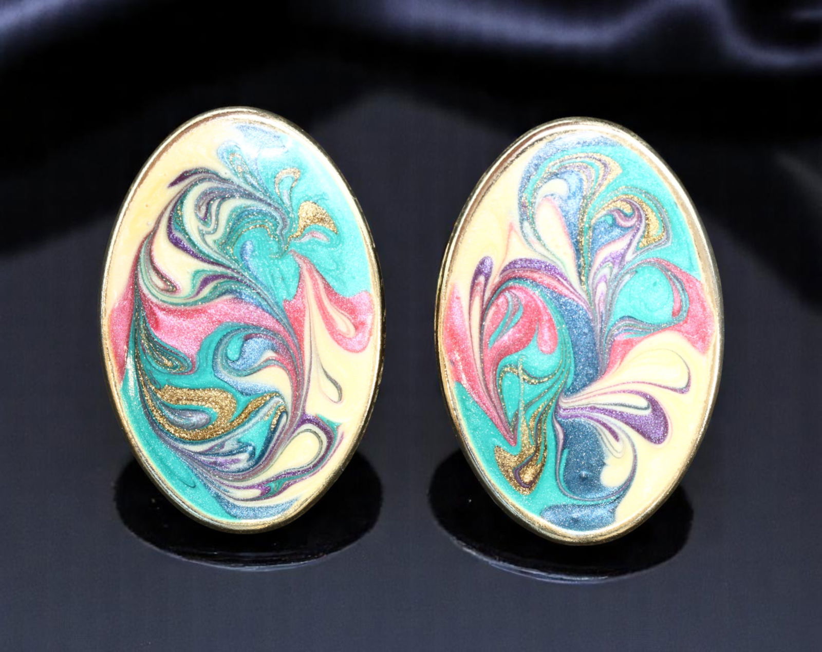 RETRO MODERN: Oval Swirl Enamel Stud Earrings - Sculptural Abstraction (30x18mm): A vivid display of Retro Modern flair, these large oval stud earrings feature a mesmerizing swirl motif rendered in multicolored enamel-like finishes. Set in a soft goldtone bezel, each earring showca