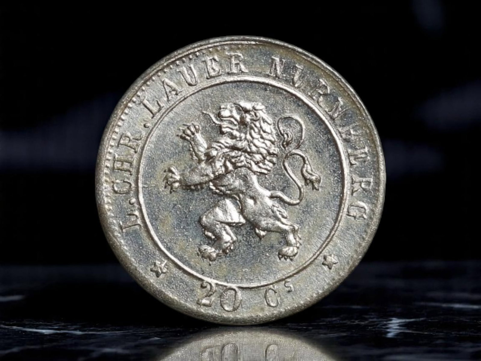 GERMANY/NURNBERG: Lauber Numismatic Portrait Token - Heraldic Lion & Classical Bust, 1888, 13mm: This petite 1888 numismatic token issued by F. Chr. Lauber of Nurnberg encapsulates the proud civic identity and intellectual spirit of late 19th-century Germany. One side bears the Nurnberg lion ramp