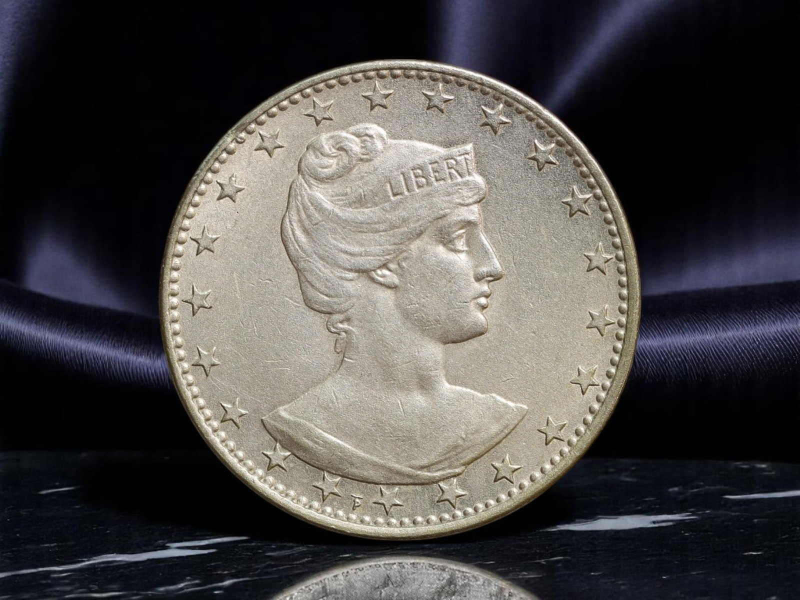 BRAZIL: Liberty & Unity - Republic 200 Reis Coin, 1931, 25mm: This 1931 200 Reis coin from Brazil encapsulates the nation's early republican ethos, where classical symbolism merged with modern statecraft. The allegorical bust of Liberty, crowned with a diadem in
