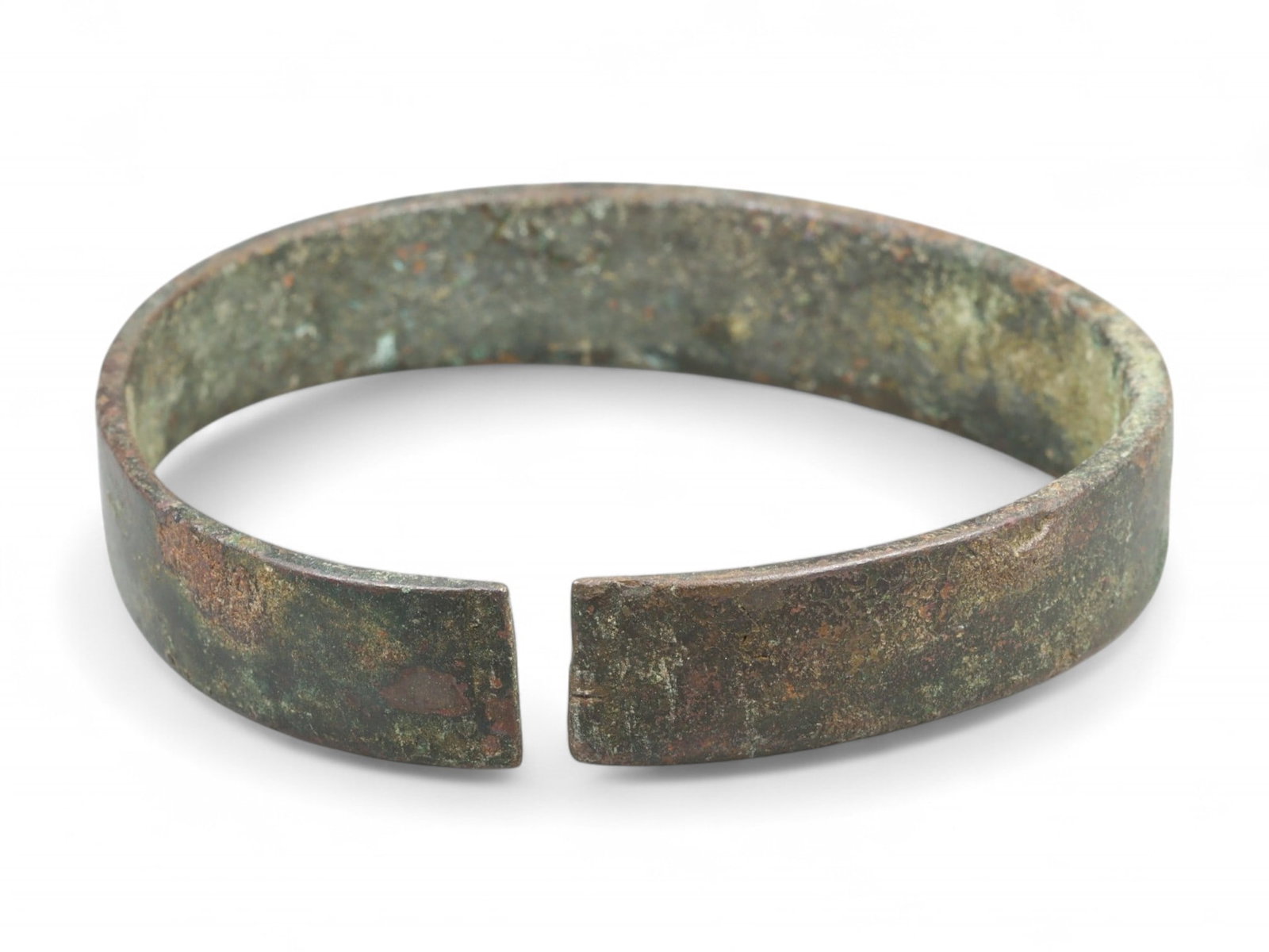 Ancient Early Medieval Peasant Wear Bronze Cuff Bracelet, c. 6th-8th Century CE: This solid and unadorned bronze bracelet originates from the Early Medieval period, circa 6th-8th century CE, a time marked by migration, transformation, and the rise of localized cultures across post