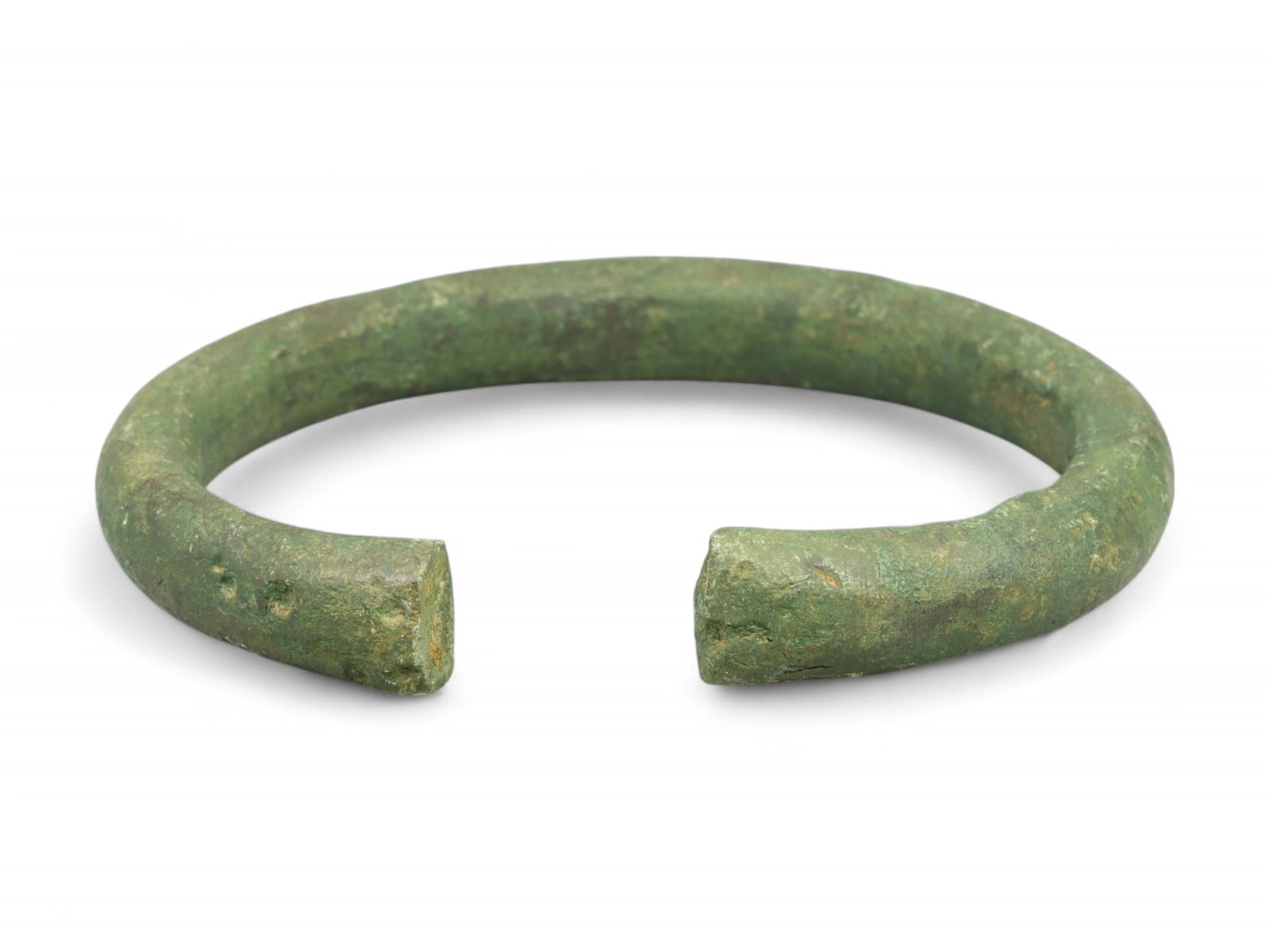 Early Medieval Slavic Rigid Cuff Bronze Bracelet, c. 8th-10th Century CE: This robust open-ended bronze bracelet, crafted during the Early Medieval period between the 8th and 10th centuries CE, reflects the utilitarian design sensibility common among Slavic and Balkan commu