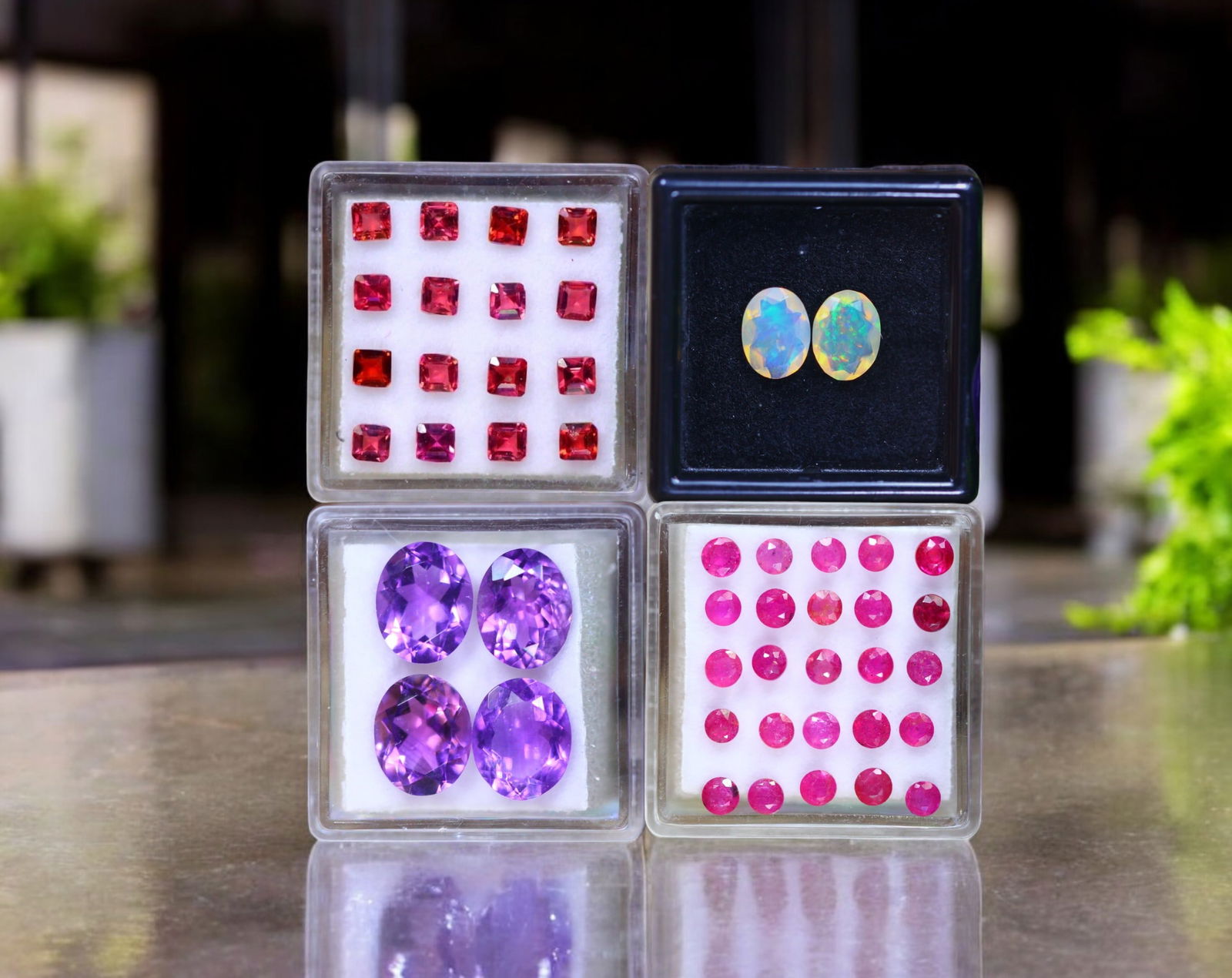 Aurora Grid - Ruby, Almandite Garnet, Amethyst, and Faceted Opal Collection: This dynamic gemstone suite is a radiant arrangement of structured fire, cosmic iridescence, and regal symmetry-designed to inspire bold compositions or refined contrast. At the forefront, twenty-five