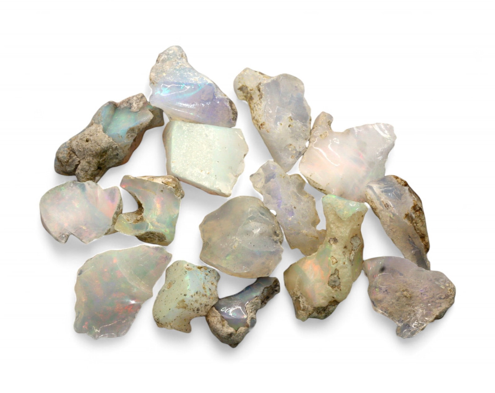 GEM LOT: Ethiopian Welo Opal Rough - Iridescent Play-of-Color in Matrix, Mixed Forms (6g): An estate-sourced parcel of natural Ethiopian Welo Opal rough, this lot features raw, matrix-hosted specimens with vibrant play-of-color across milky, translucent, and honey-toned bodies. Flashes of g