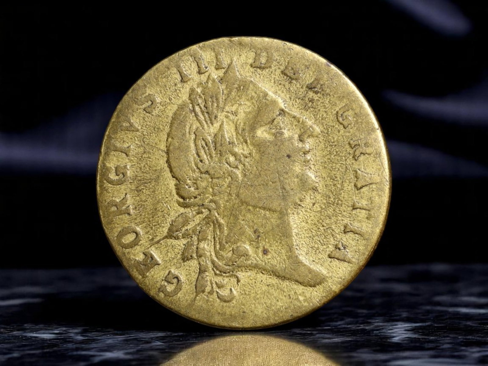 GREAT BRITAIN: George III - "In Memory of the Good Old Days" Political Token, 1788, 20mm: Issued in 1788 at the cusp of Britain's industrial and political transformation, this brass token commemorates King George III in a nostalgic and possibly satirical tone. The obverse bears a laureate 