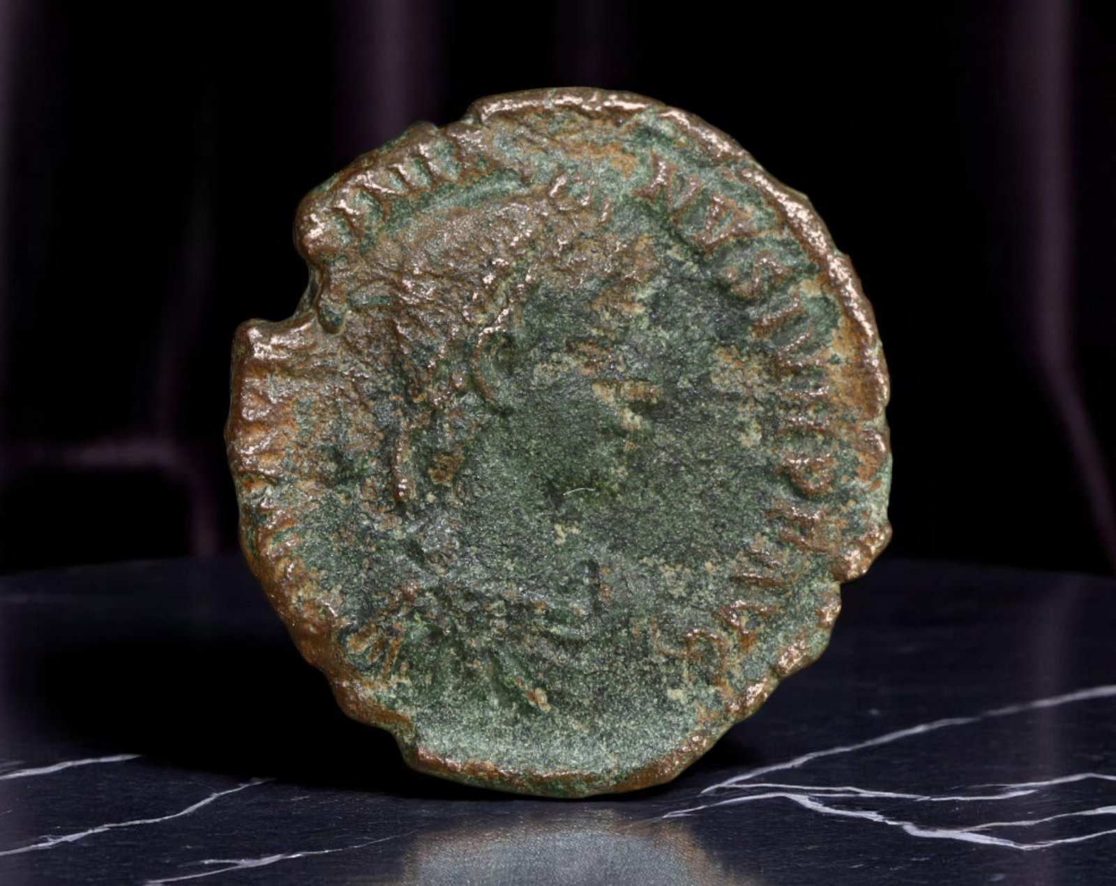 ROMAN EMPIRE: Ancient AE Coin Bronze Issue, 18mm: Issued during one of the most transformative epochs of the Roman Empire, this bronze coin embodies the endurance and adaptability of Roman statecraft across centuries. Its compact flan and timeworn su