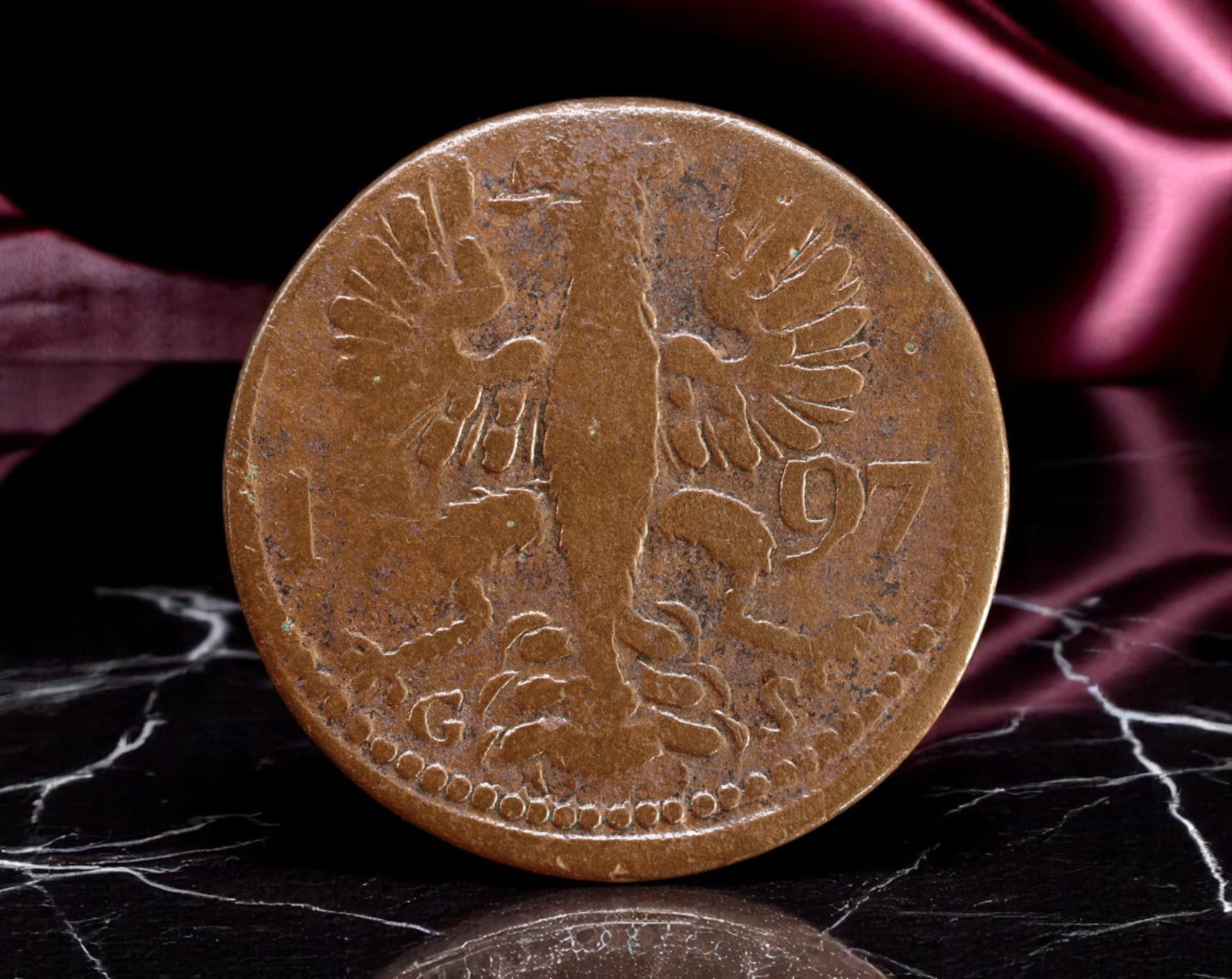 GERMANY/AACHEN: Imperial Eagle - City of Aachen 12 Heller Coin, 1797, 25mm: Minted in 1797 during the waning years of the Holy Roman Empire, this copper 12 Heller coin from the Free Imperial City of Aachen reflects the city's proud autonomy within a fractured imperial system.
