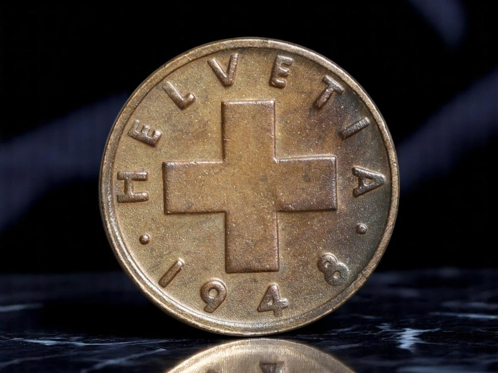 SWITZERLAND: Helvetic Industry - Labor Emblem 1 Rappen Coin, 1948, 16mm: Struck in the post-war years of rebuilding and stabilization, this 1948 Swiss 1 Rappen coin captures the essence of Helvetic resilience through potent national and agrarian symbolism. The obverse pres