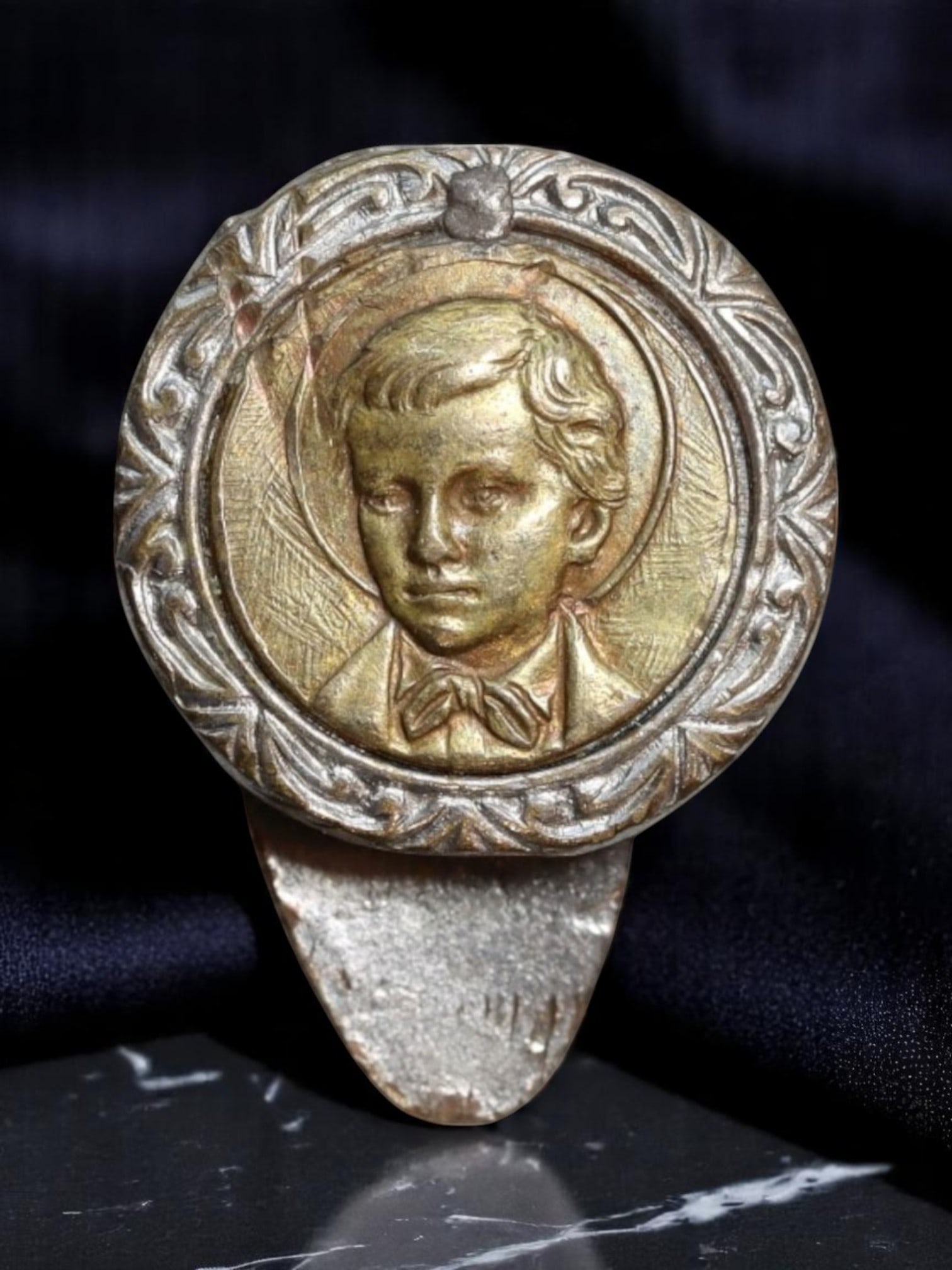ITALY: Saint Domenico Savio - Youthful Piety Portrait Devotional Clip, c.1950s, 18mm: This rare devotional clip features a radiant profile of Saint Domenico Savio, the youthful disciple of Don Bosco, whose life was marked by exceptional sanctity and a profound devotion to the Virgin Ma
