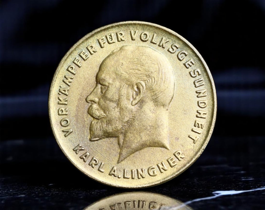 GERMANY: Karl August Lingner - Health Pioneer 10 Warenpunkte Coin, c.1920s Dresden (22mm): This historically intriguing 10 Warenpunkte promotional coin was issued by the Lingner-Werke in Dresden, celebrating Karl August Lingner-innovative public health advocate and founder of Odol mouthwash