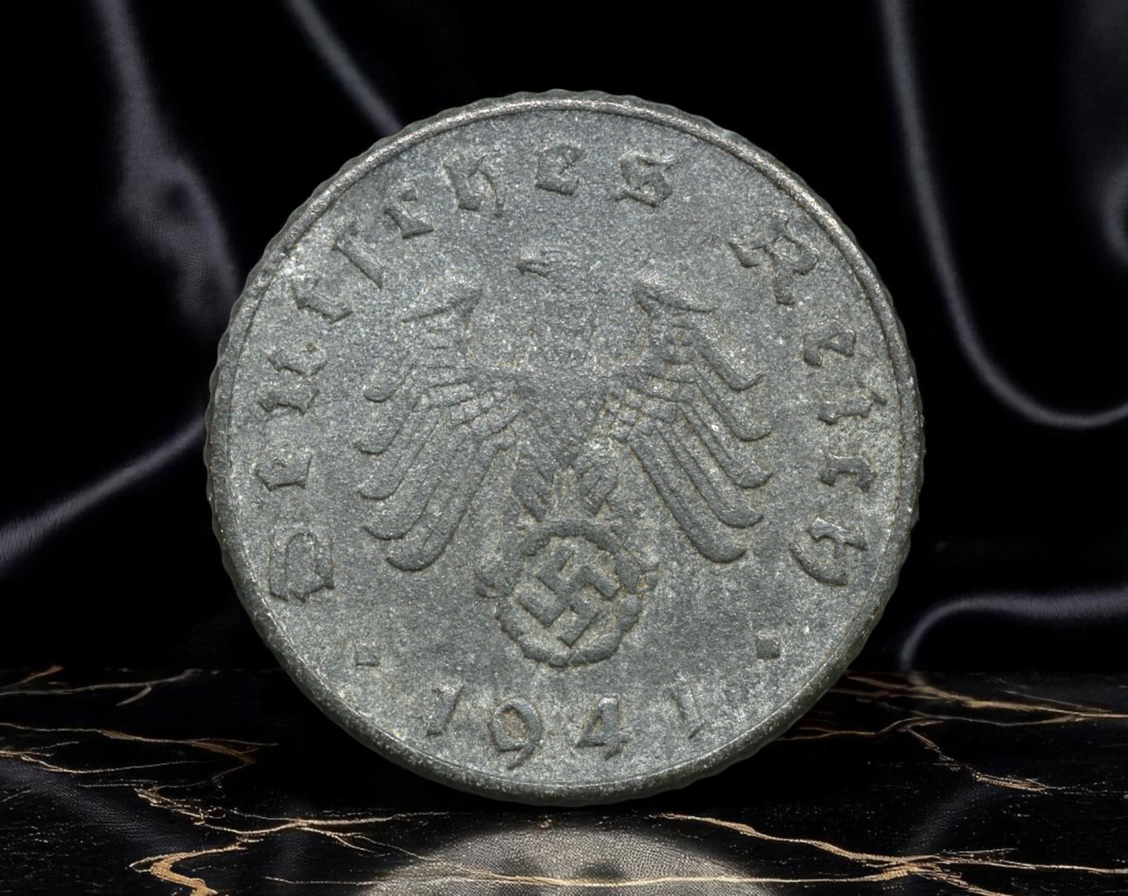 GERMANY/THIRD REICH: Wartime Economy - Reichsadler 5 Reichspfennig Coin, 1941, 18mm: Minted in 1941 at the height of World War II, this 5 Reichspfennig coin reflects Germany's total mobilization of resources under the Nazi regime. Struck in zinc-a material chosen for wartime austerity