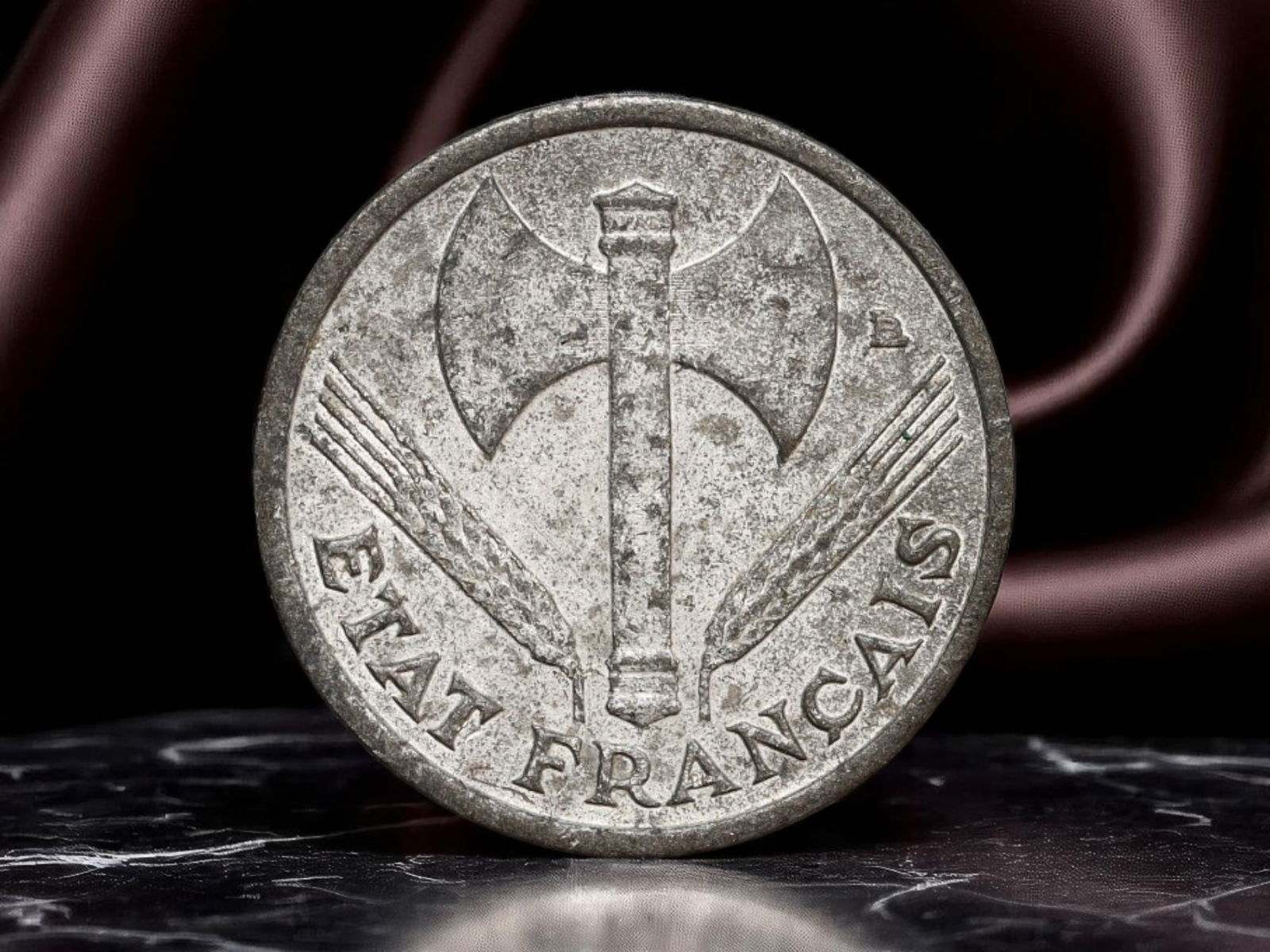 FRANCE/VICHY REGIME: Etat Francais - Travail-Famille-Patrie 50 Centimes Coin, 1943, 18mm: Struck under the authoritarian Vichy regime during World War II, this 1943 50 Centimes coin reflects a stark political and ideological departure from the republican ideals of liberty and fraternity. T