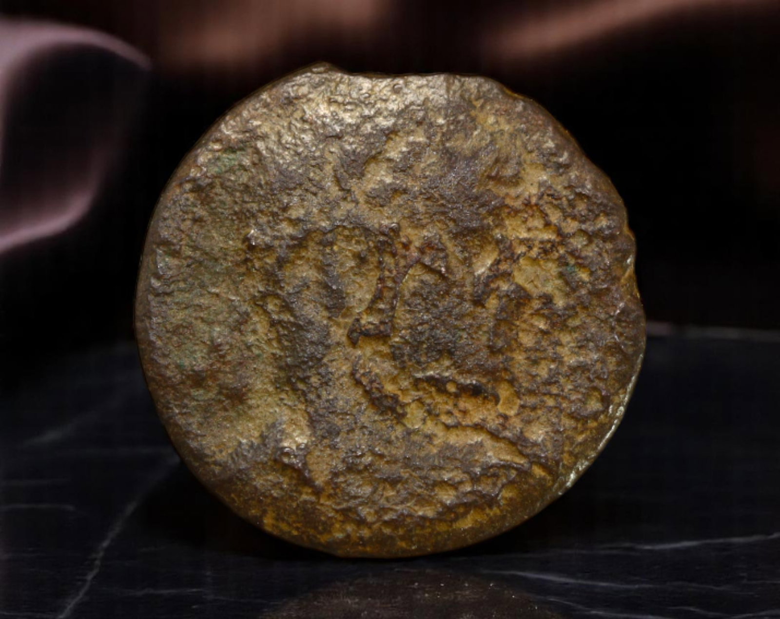 ROMAN EMPIRE: Ancient AE Coin Bronze Issue, 15mm: Issued during one of the most transformative epochs of the Roman Empire, this bronze coin embodies the endurance and adaptability of Roman statecraft across centuries. Its compact flan and timeworn su
