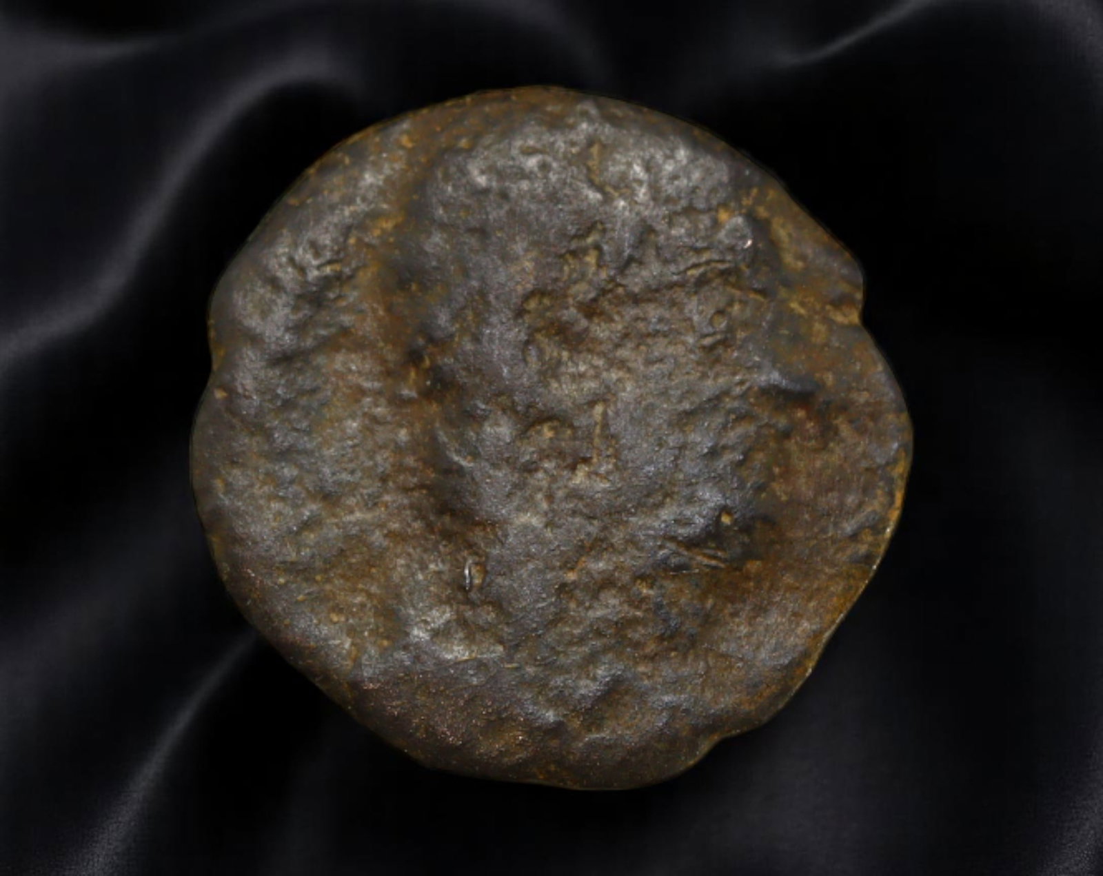 ROMAN EMPIRE: Ancient AE Coin Bronze Issue, 14mm: Issued during one of the most transformative epochs of the Roman Empire, this bronze coin embodies the endurance and adaptability of Roman statecraft across centuries. Its compact flan and timeworn su
