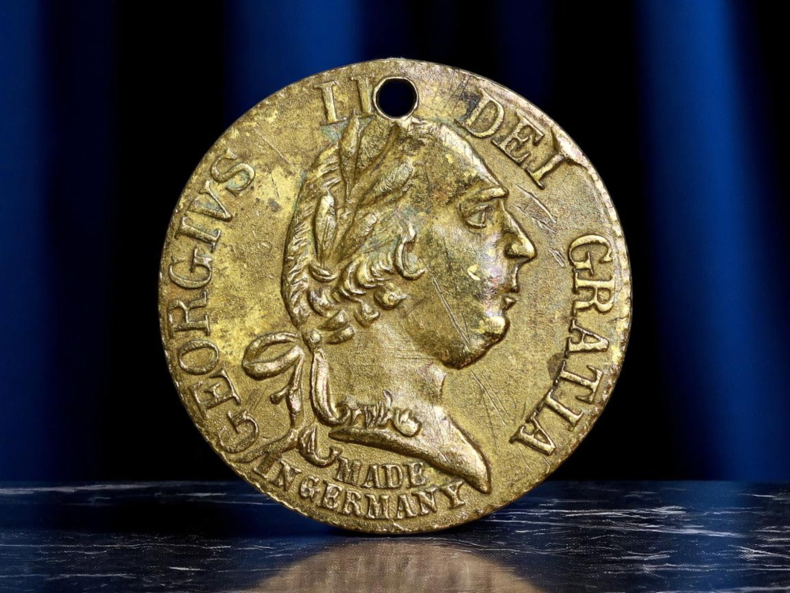 GREAT BRITAIN: George III - Royal Arms Patriotic Jeton, 1790, 21mm: This evocative 1790 brass jeton honors the enduring presence of George III during a politically volatile era in Europe. His laureated profile bears the inscription GEORGIVS III DEI GRATIA, signifying 