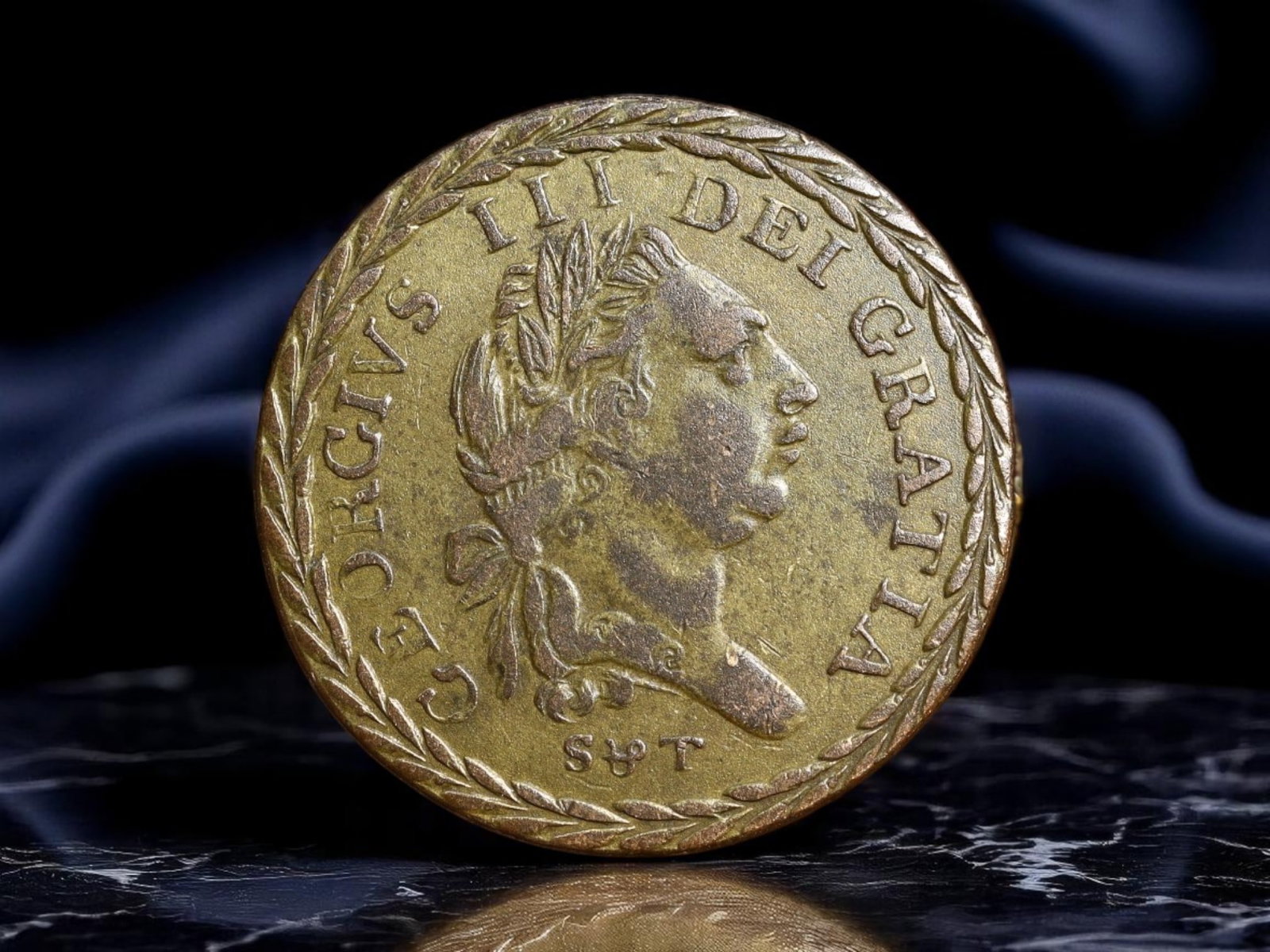 UNITED KINGDOM: George III Era - Royal Arms Gaming Token, ca. 1800, 24mm: Evoking the regal aesthetics of the late Georgian period, this brass gaming token mimics the grandeur of the official coinage under King George III. The laureate bust of the monarch is surrounded by G