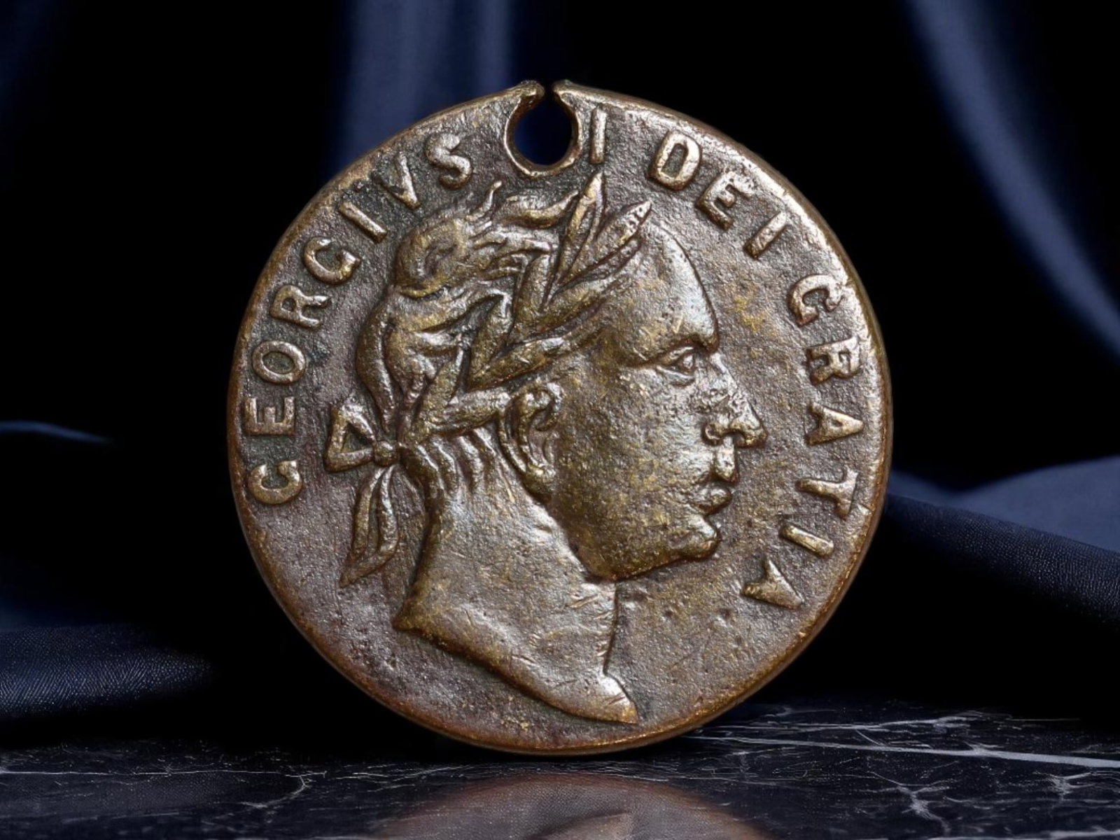 GREAT BRITAIN: George III - Loyalist "Good Old Days" Political Token, 1768, 21mm: Evoking the ideological aftershocks of the Glorious Revolution, this 21mm brass political token serves as a tangible voice of 18th-century monarchist sentiment. Bearing a right-facing laureate bust of