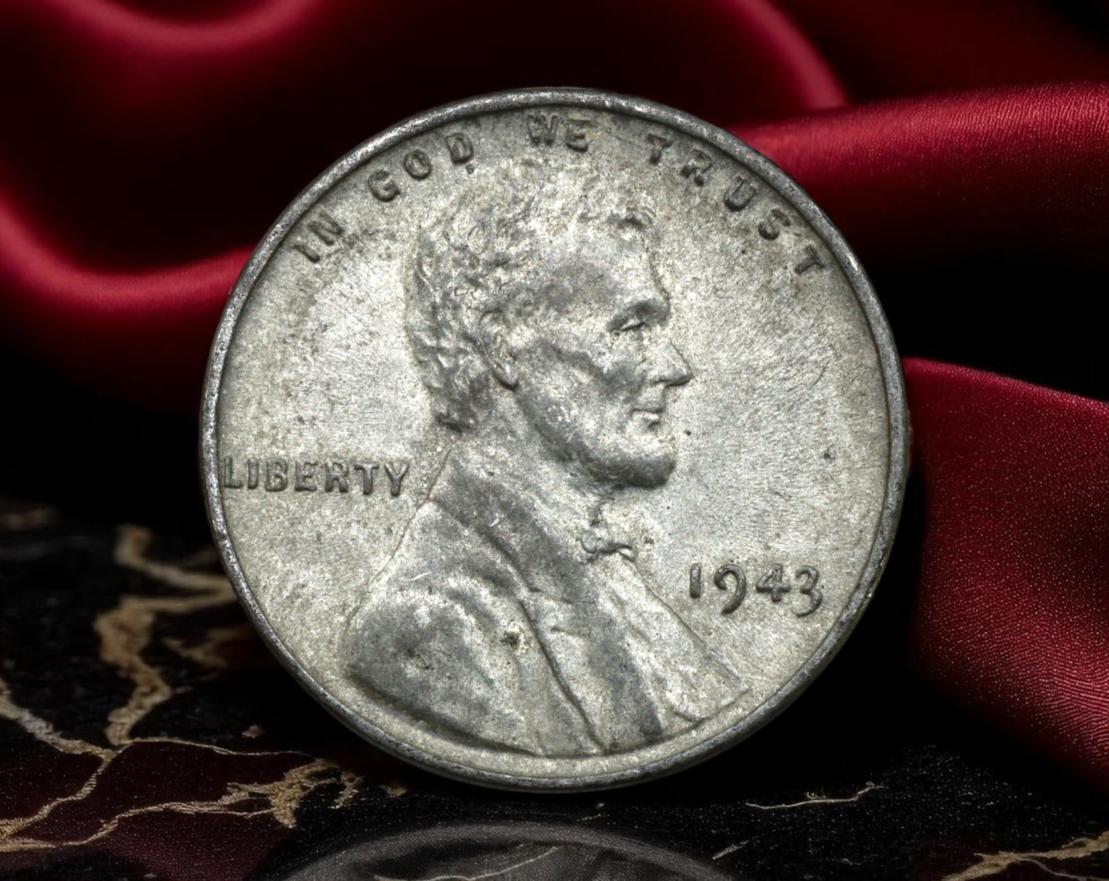 UNITED STATES: Wartime Steel - Lincoln Wheat Cent Coin, 1943, 19mm: Struck in the crucible of World War II, the 1943 Lincoln Wheat Cent stands as a tangible product of national sacrifice and industrial redirection. This singular year saw the traditional bronze alloy r