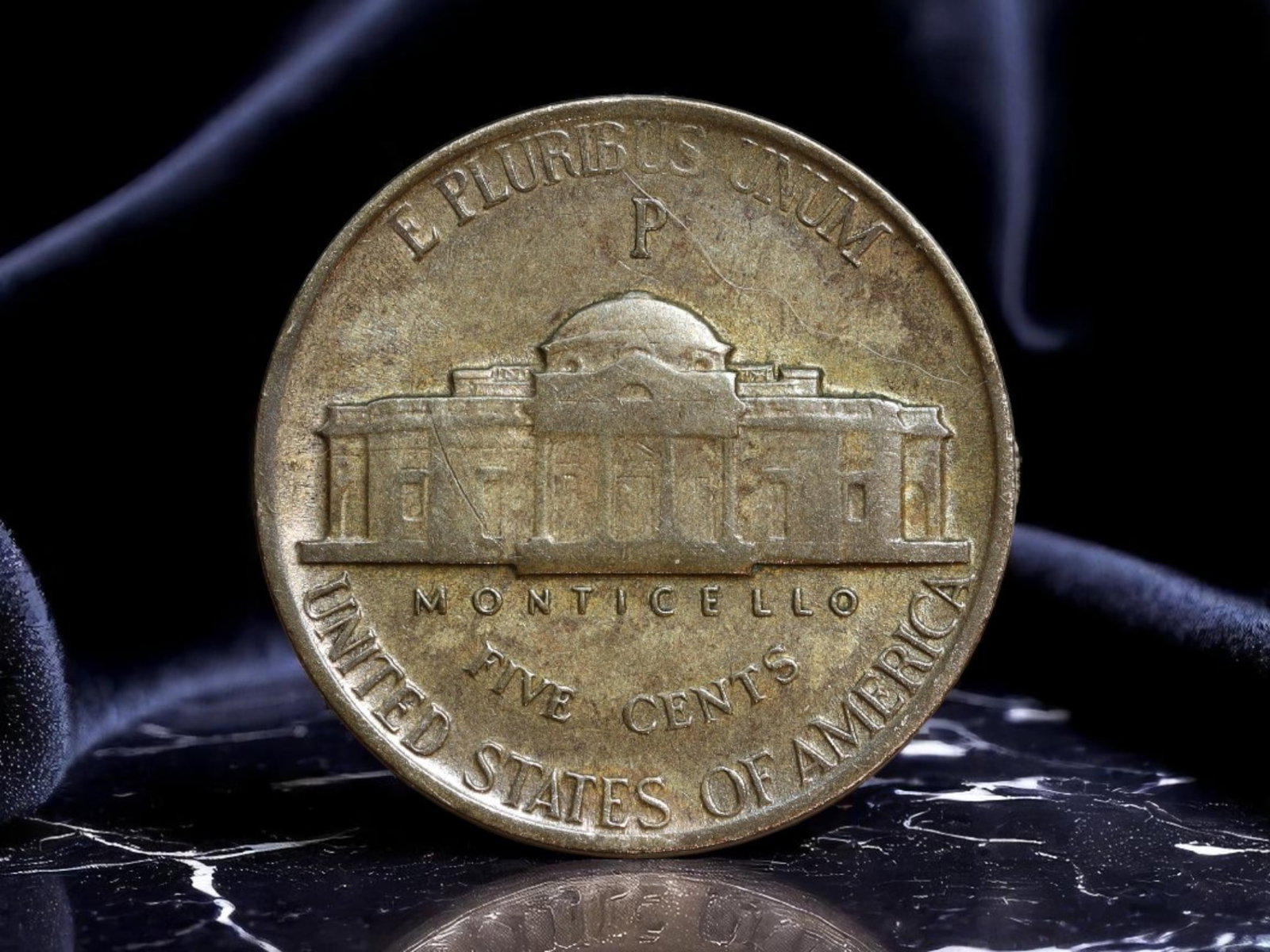 UNITED STATES: Wartime Economy - Jefferson Wartime Nickel, 1943 P, 21mm: Struck during the height of World War II, this 1943 Jefferson nickel reflects the strategic shifts in American coinage amid a global conflict. The obverse features the steadfast profile of Thomas Jeff