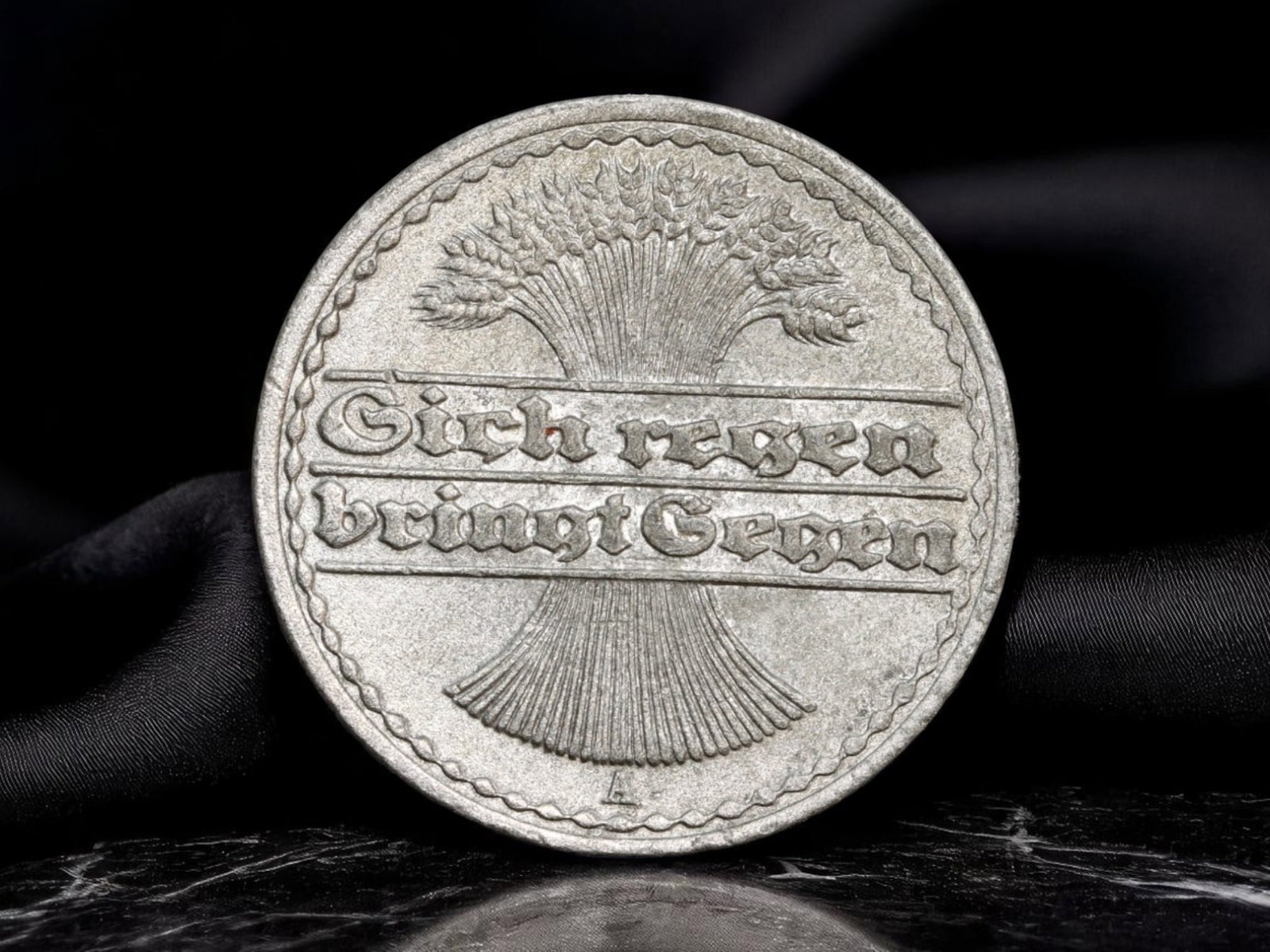 GERMANY/WEIMAR REPUBLIC: Agricultural Revival - 50 Pfennig Coin, 1919 A, 23mm: Issued in the wake of World War I, this 1919 50 Pfennig coin reflects the nascent Weimar Republic's push for economic recovery and national morale through agrarian symbolism. A bundled sheaf of grain 