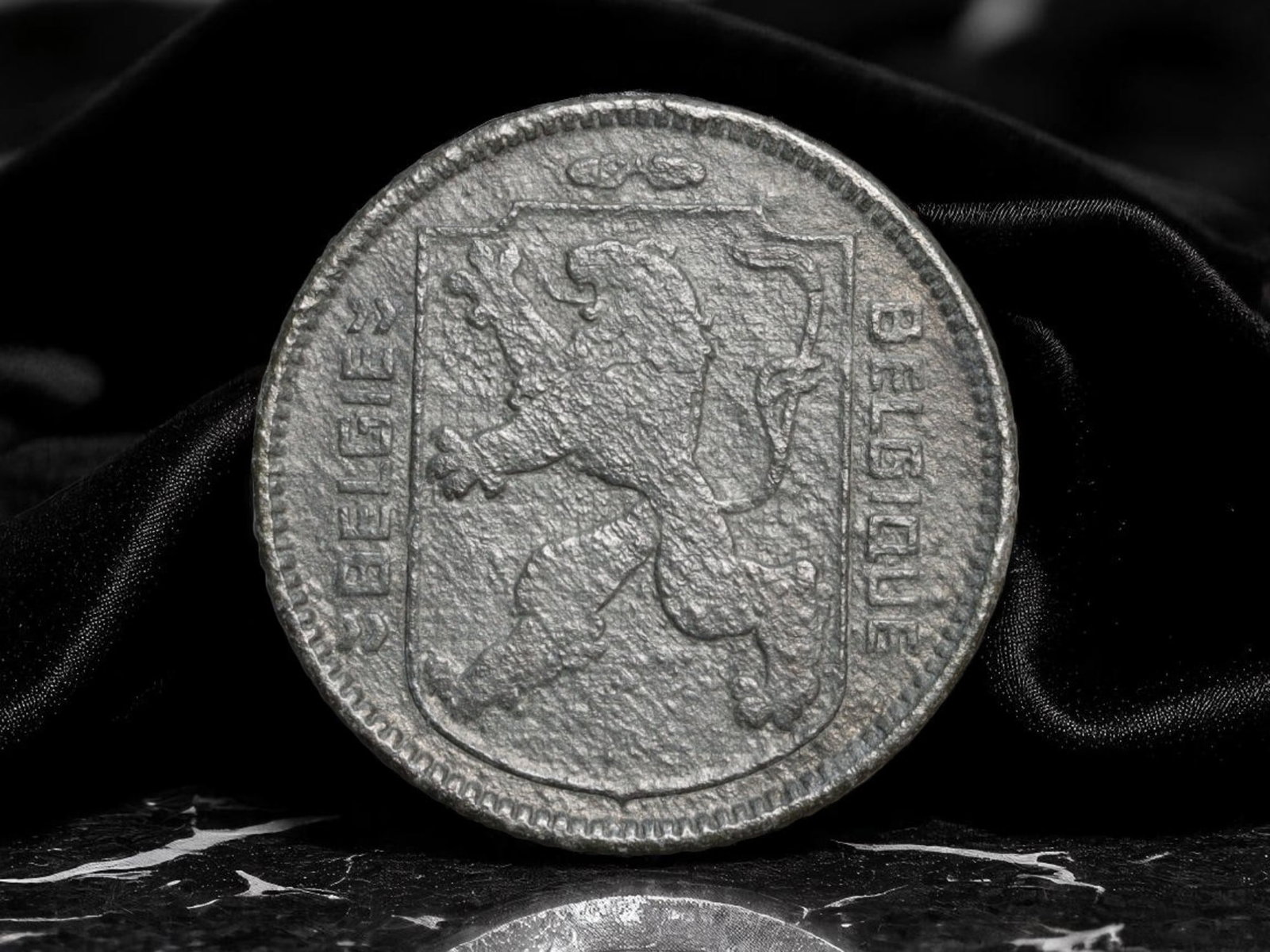BELGIUM: Postwar Reconstruction - Crowned Monogram 1 Franc Coin, 1946, 22mm: Issued in the immediate aftermath of World War II, this 1 Franc coin from 1946 embodies Belgium's determination to rebuild and unify. The crowned monogram on the reverse, rendered in stylized, almost 