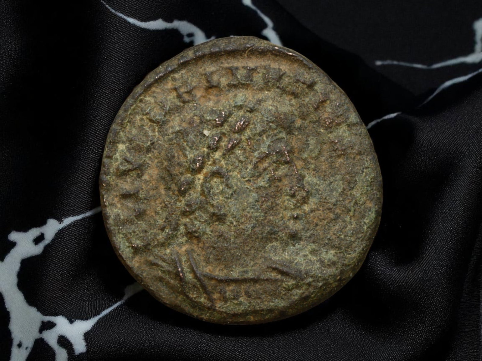 ANCIENT ROMAN EMPIRE: Ancient AE Bronze Coin Issue, 16mm: Issued during one of the most transformative epochs of the Roman Empire, this bronze coin embodies the endurance and adaptability of Roman statecraft across centuries. Its compact flan and timeworn su