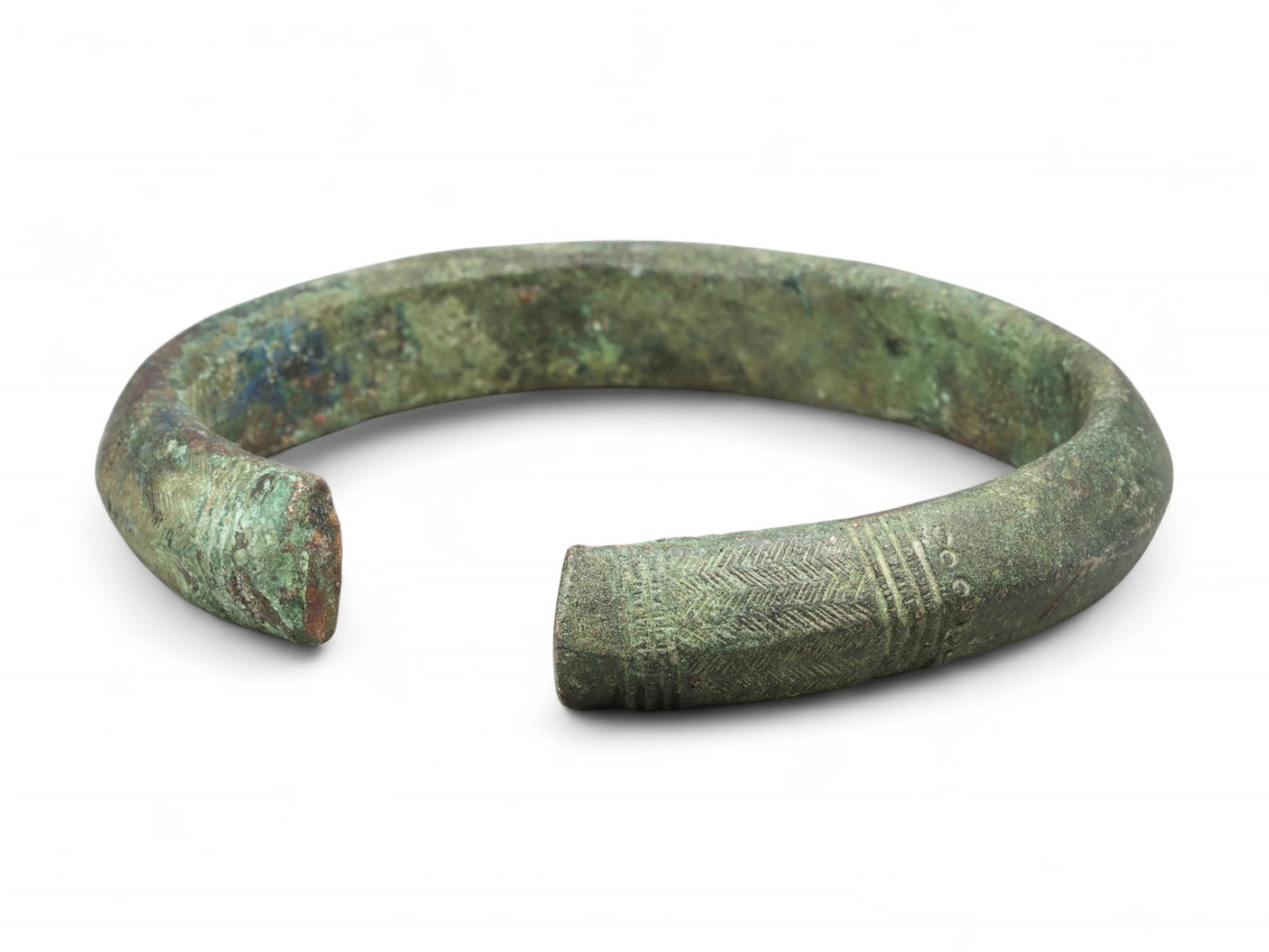 Medieval European Chevron Pattern Bronze Armlet of Status, c. 10th-13th Century CE: This striking bronze armlet, dating from the 10th to 13th century CE, is a quintessential example of medieval European metallurgy and aesthetic symmetry. Cast with commanding thickness and adorned wit