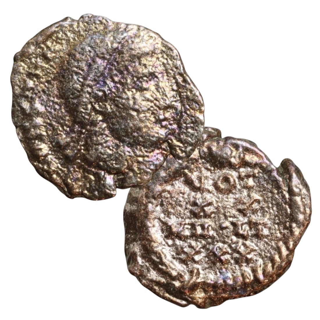 ANCIENT ROMAN EMPIRE: Ancient AE Bronze Coin Issue, 15mm: Issued during one of the most transformative epochs of the Roman Empire, this bronze coin embodies the endurance and adaptability of Roman statecraft across centuries. Its compact flan and timeworn su