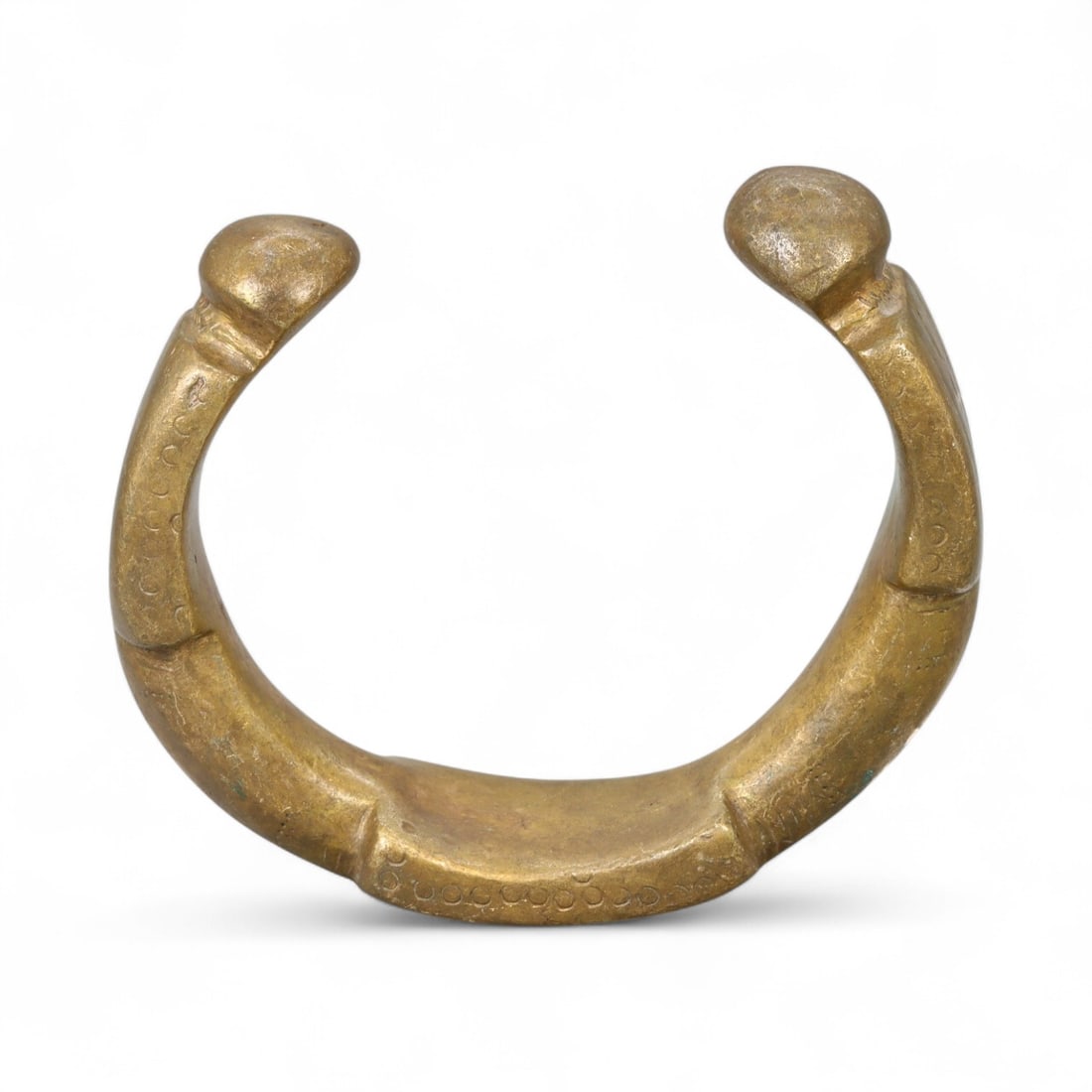 West African Heavily Cast Bronze Manilla Bracelet with Segmental Reliefs, c. 17th-19th Century CE (1 of 2)