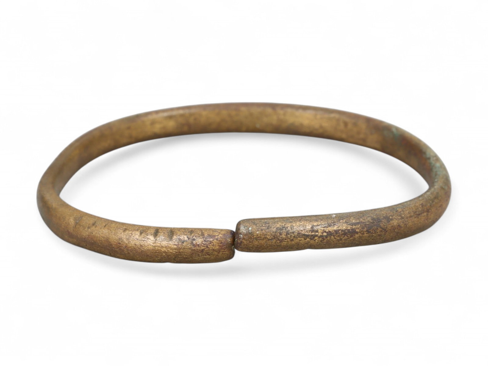 Ancient Roman Gilt Bronze Precision-Fitted Bracelet, c. 1st-3rd Century CE: This exceptionally crafted Roman bracelet, measuring 6 cm (2.36 inches) in diameter, showcases the refined engineering and aesthetic balance prized in early Imperial adornment. Made of bronze and orig