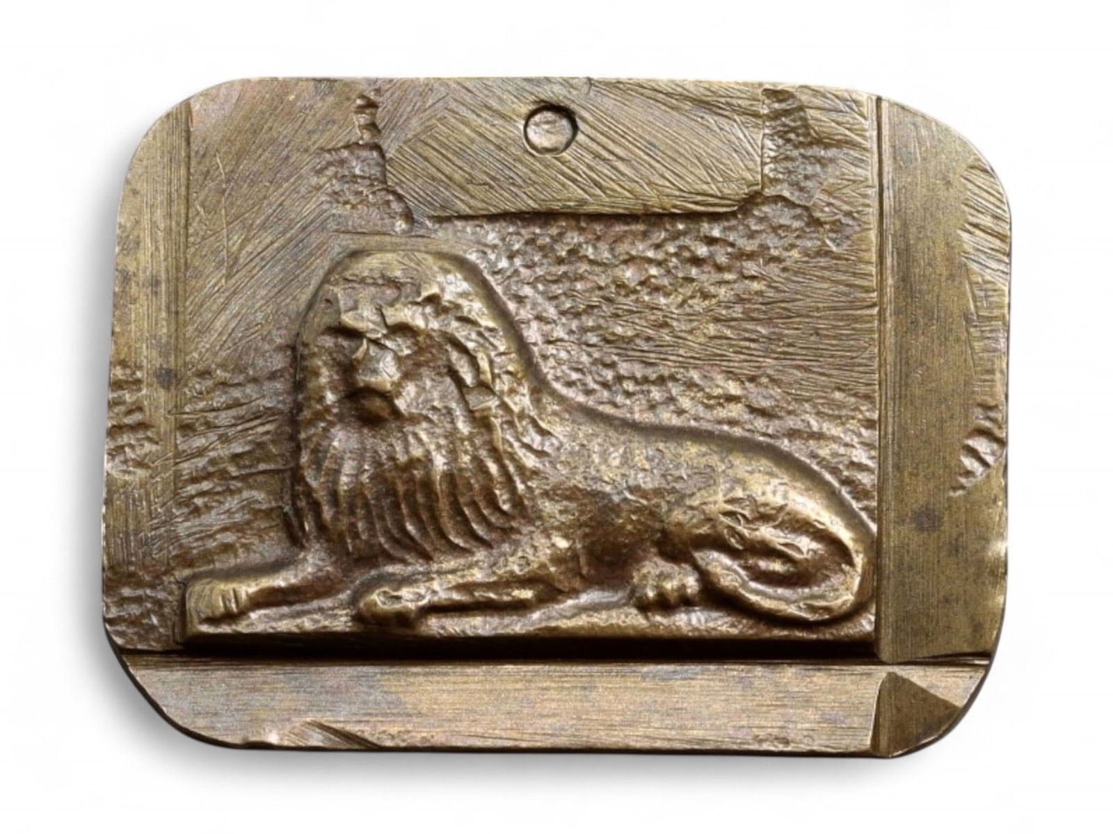 NEOCLASSICAL REVIVAL: Decorative Weight or Medallion - Reclining Lion Relief, Bronze-Tone Cast: A sculptural piece rendered in bronze-tone metal, this compact rectangular form features a deeply cast relief of a reclining lion set against a textured background, framed by angular linear borders. L