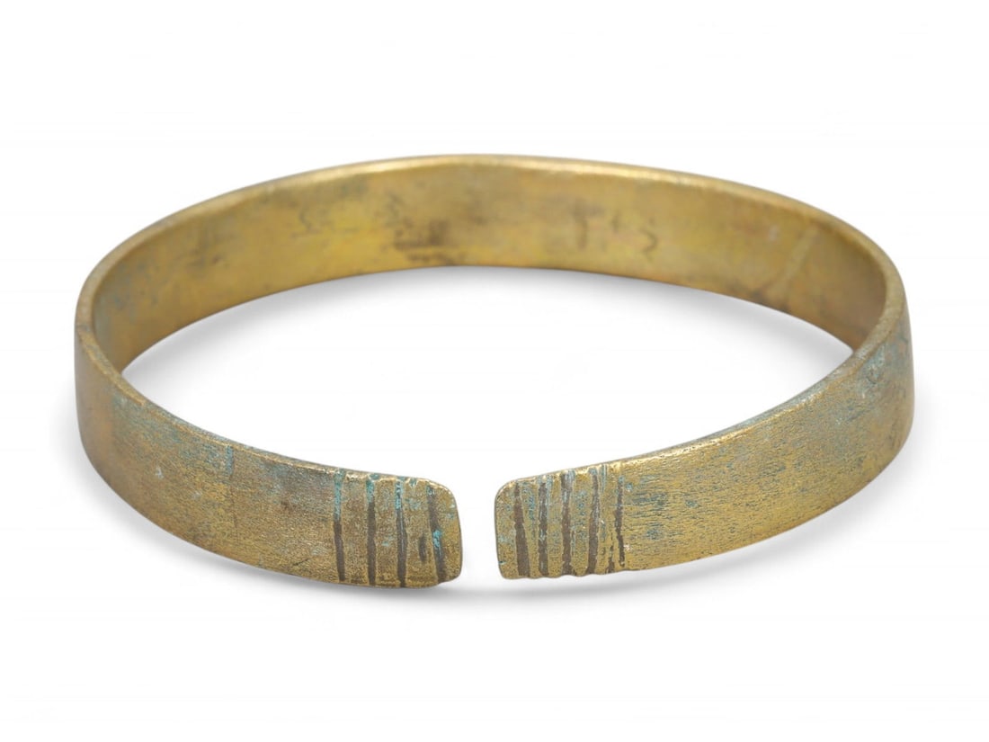 Ancient Medieval Eastern European Simple Cuff Bronze Bracelet, c. 10th-12th Century CE: This minimalist bronze bracelet, dated to the 10th-12th century CE, exemplifies the utilitarian elegance of early medieval Eastern European ornamentation. Cast with precision and weighing 36 grams (1.