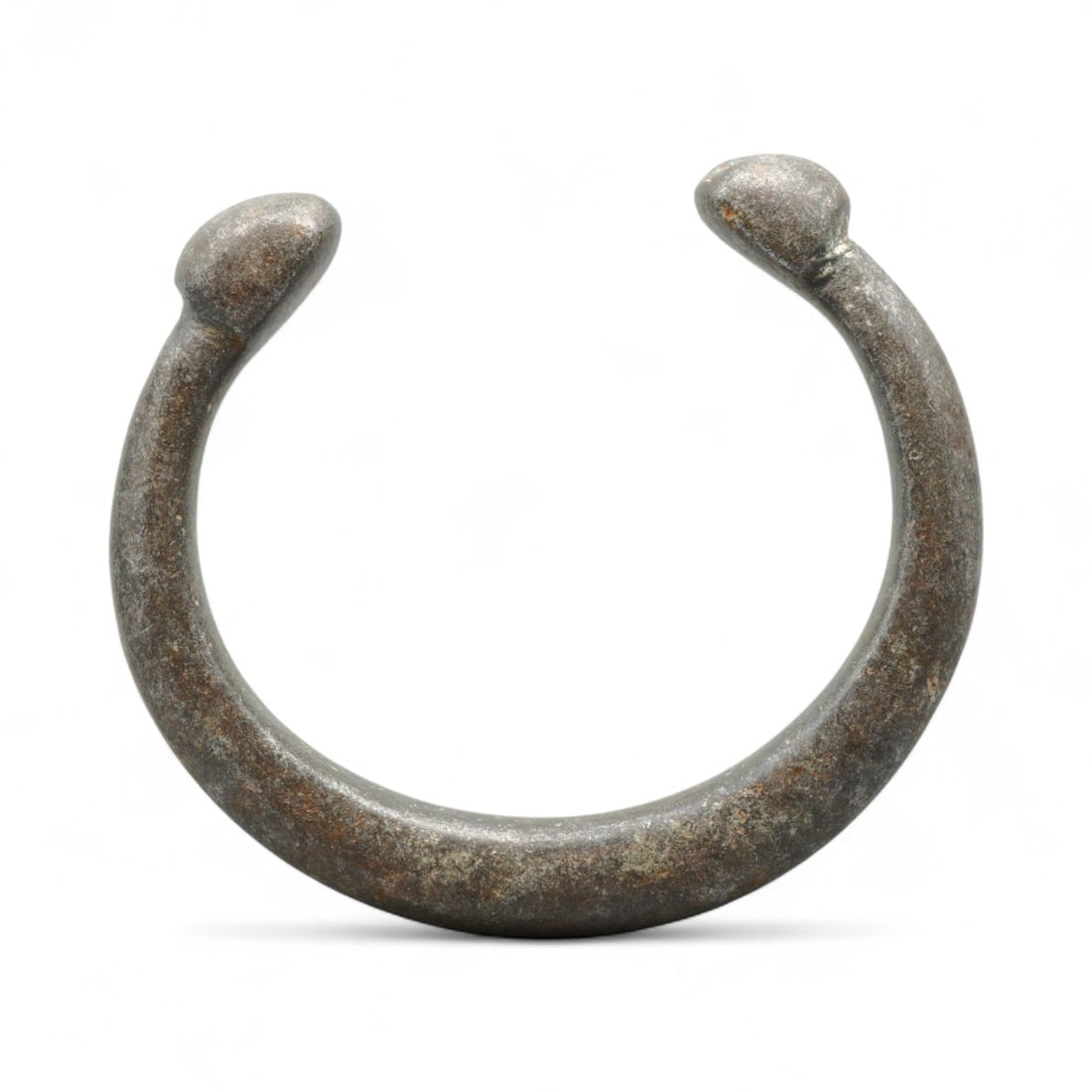 Antique West African Cast Aluminum Trade Bracelet, c. 18th-19th Century CE: This substantial cast aluminum bracelet from West Africa dates to the 18th-19th century CE and was likely used both as adornment and as a form of trade currency. Measuring 6.8 cm, the bracelet is defi