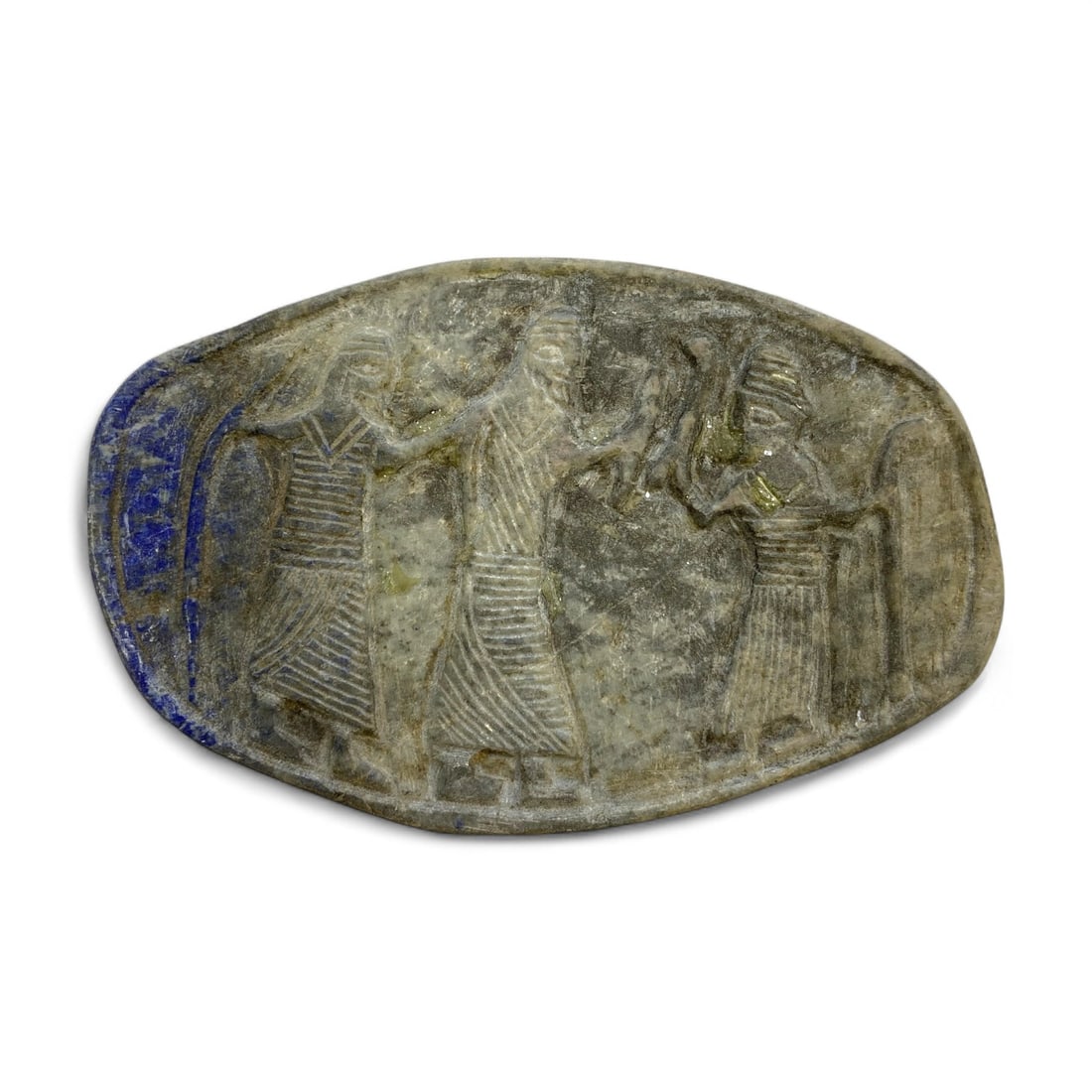 Ancient Mesopotamian Lapis Lazuli Ritual Plaque with Processional Relief, 2nd Millennium BCE, 140g: This magnificent carved lapis lazuli plaque, measuring 13 x 8.5 cm (5.11 x 3.34 in) and weighing 140 grams (4.94 oz), originates from the heart of ancient Mesopotamia-likely from the Kassite or Middle